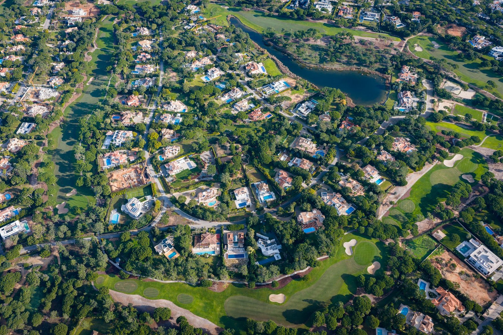 Exclusive Luxury Real Estate at San Lorenzo Golf Course: 4K Aerial View of Palatial Mansions, Private Infinity Pools, and Championship Fairways in Quinta do Lago, Algarve, Portugal