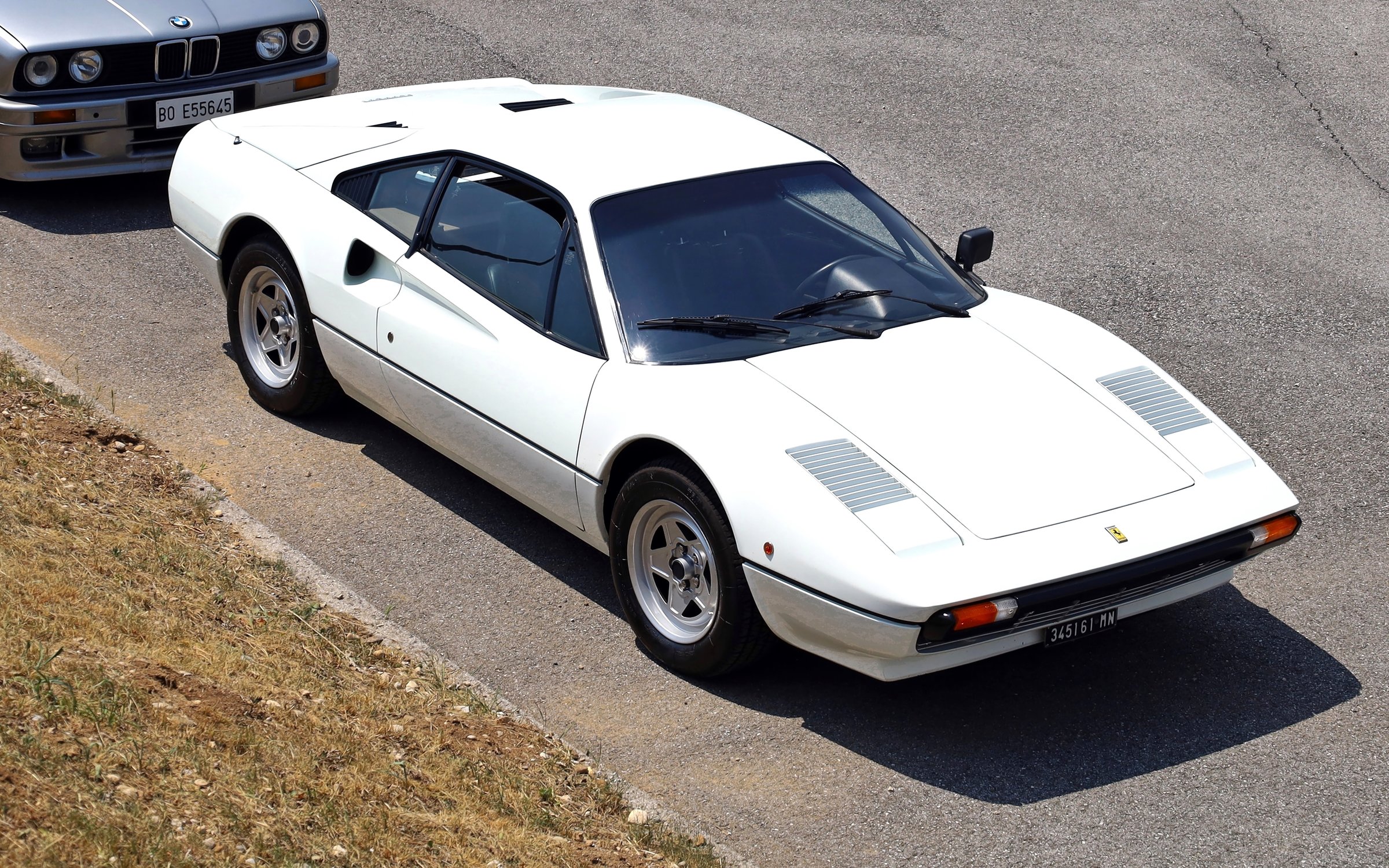 Azzida, Italy. July 5 2025. Top view of the iconic Ferrari 308 GTB, vintage sports car from Seventies and Eighties, during a car rally.