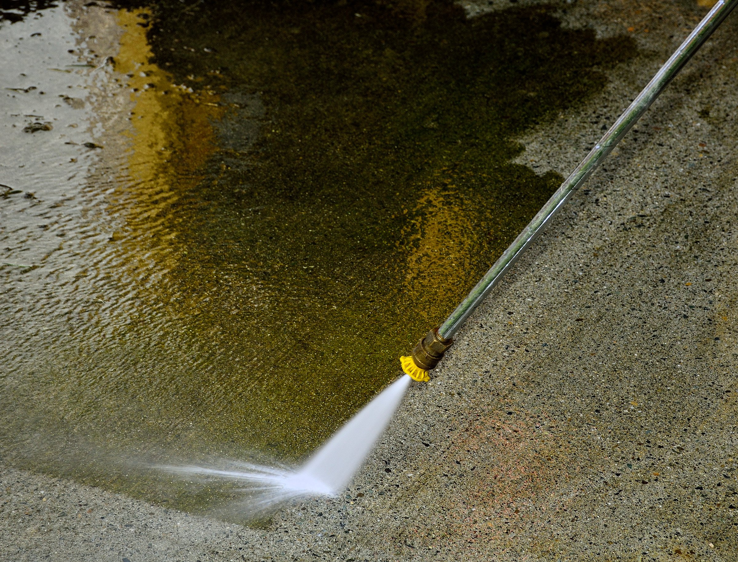 Pressure washing a concrete floor