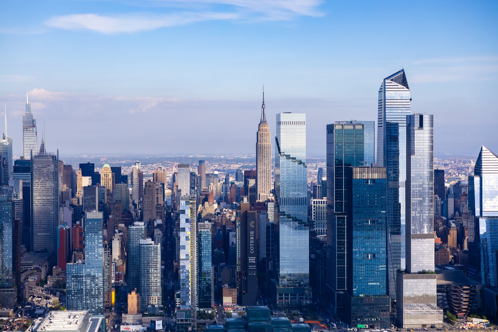 A bird's eye view of the New York City skyline during the day and at night. The city that never sleeps, with breathtaking architecture.