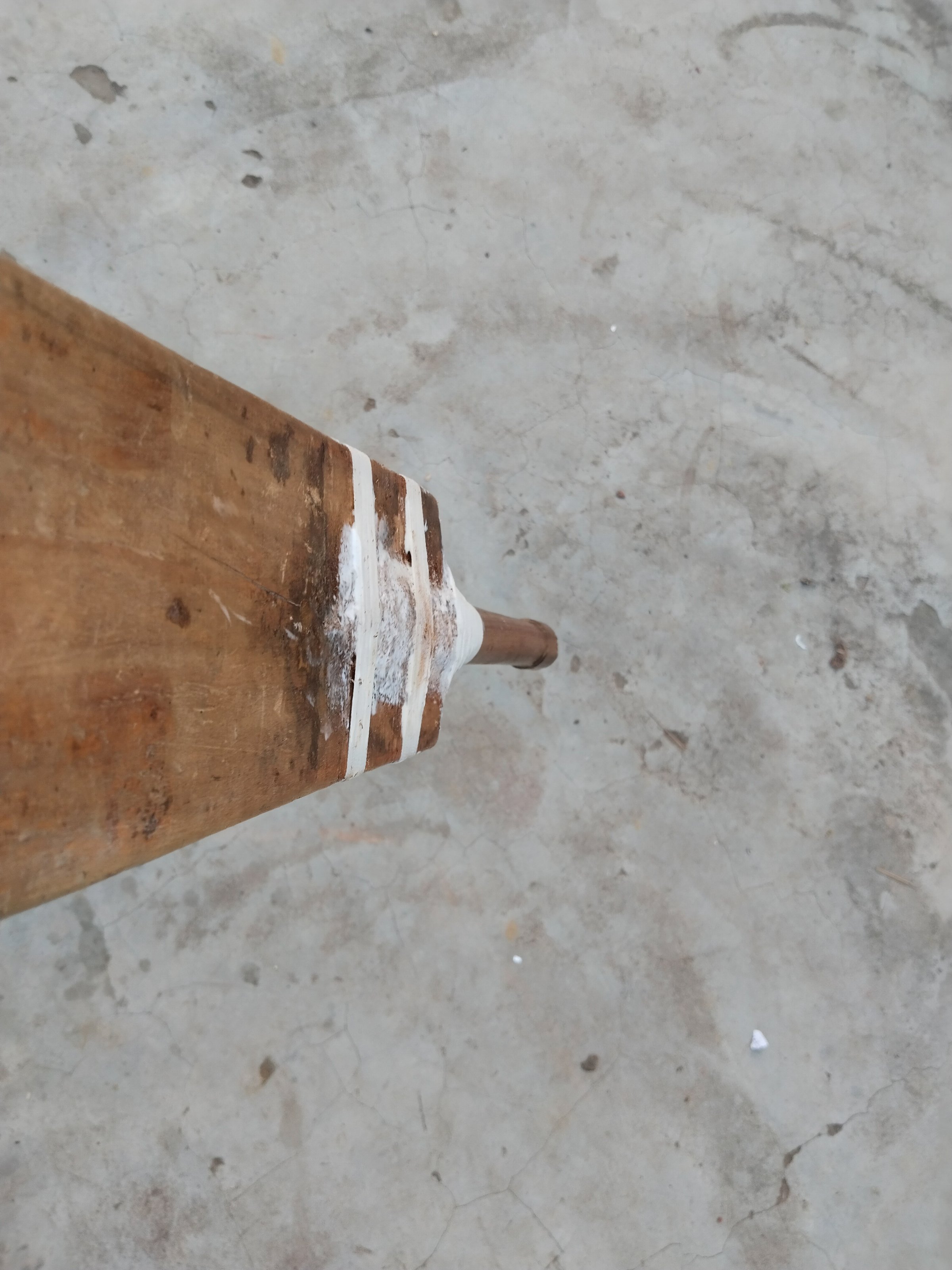 closeup of a old  broken cricket bat preparing by heavy thread and gum