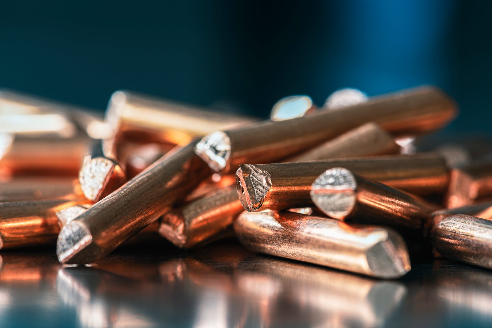 Copper wire scraps on industrial metal surface