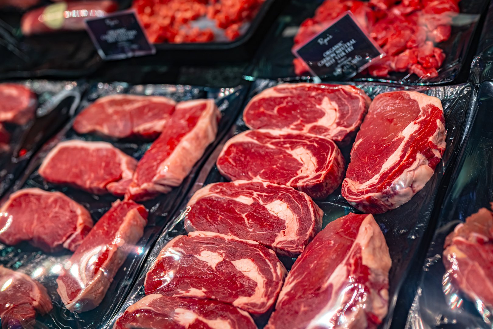 Meat products put up for sale in a supermarket commercial refrigerator