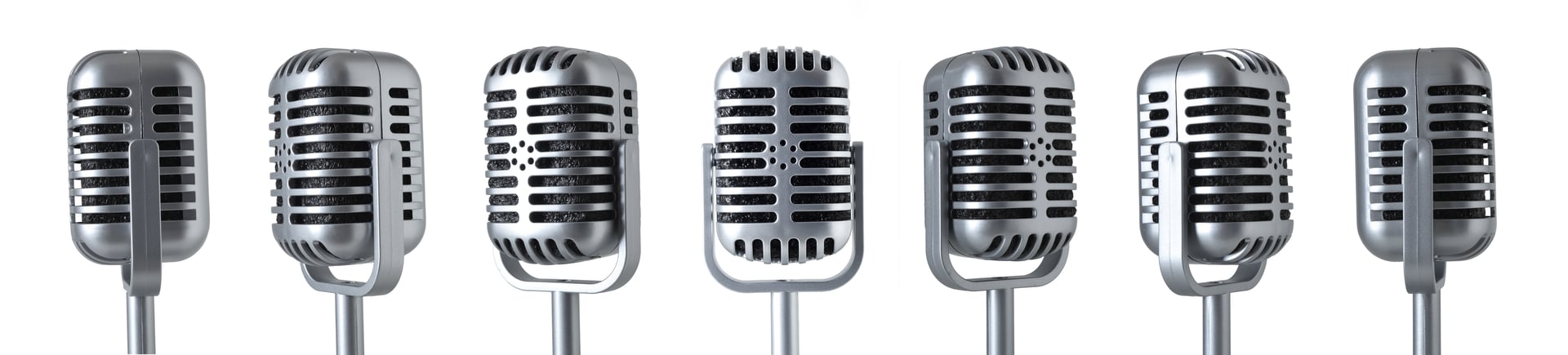 Various views of vintage metal condenser microphone with stand isolated on white background.