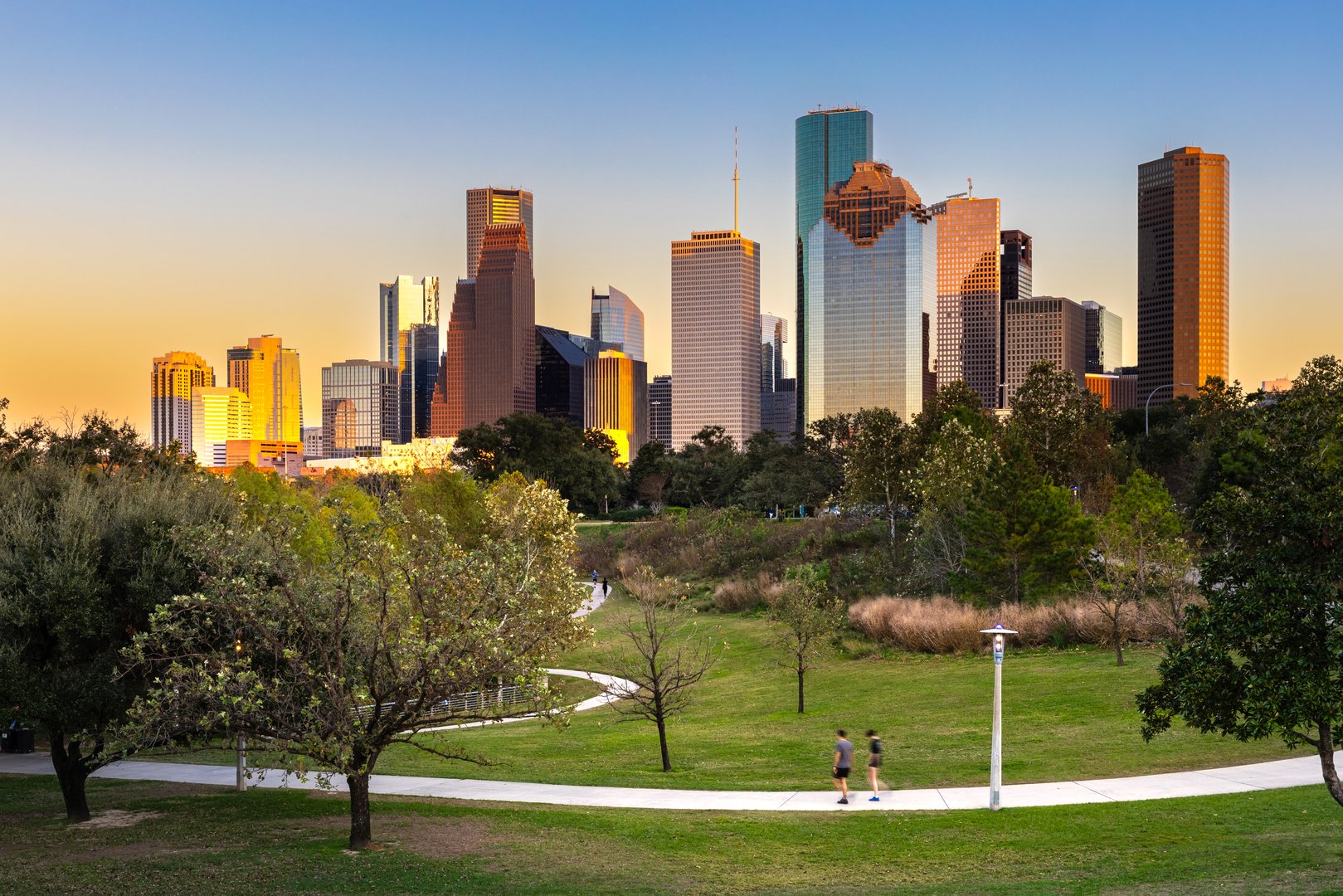 Houston Downtown modern business city with skyscraper city scape with park view from Buffalo Bayou center of Houston city, Texas, United States of America, US at sunset time