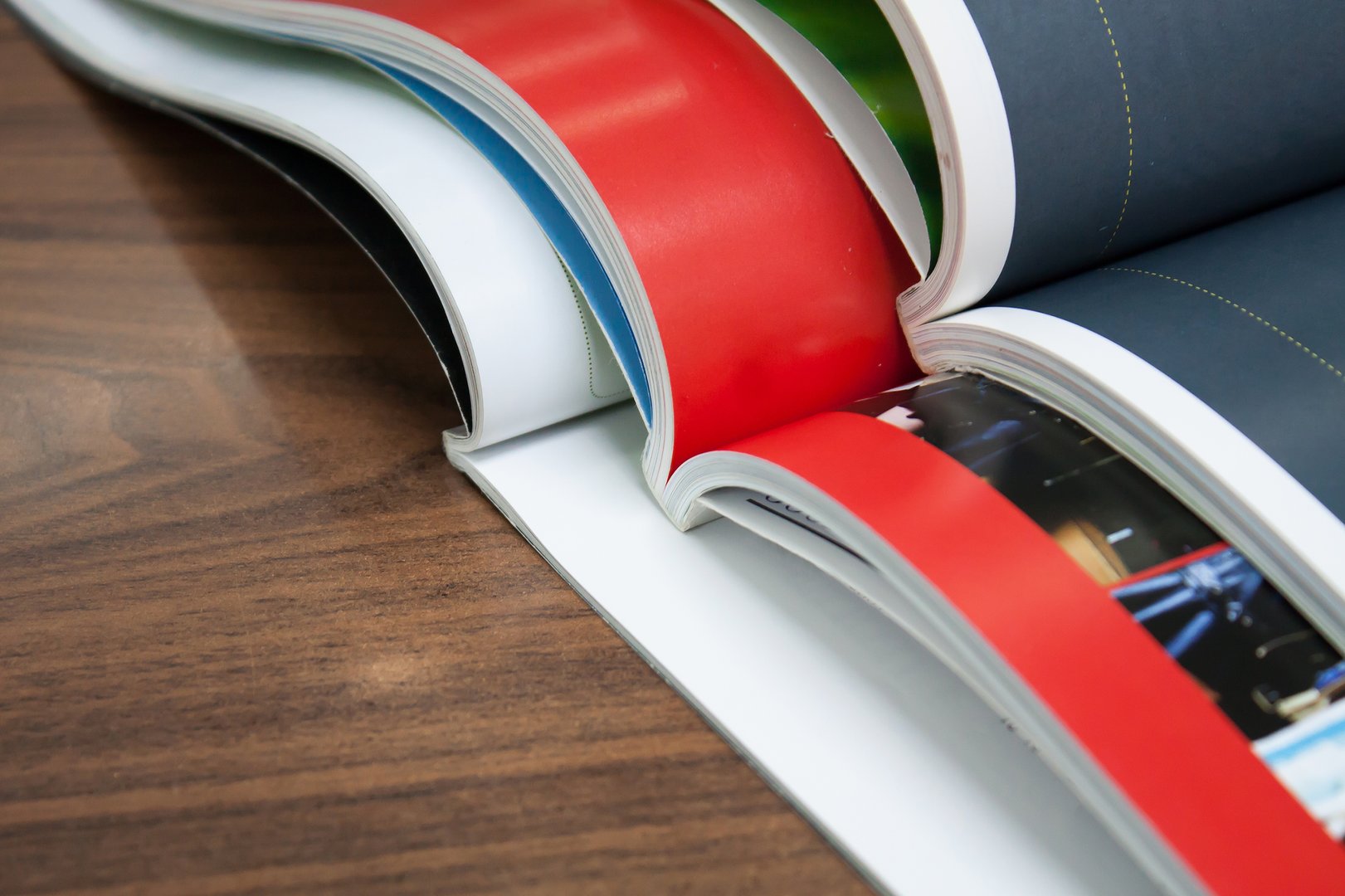 Stack of magazines on wood table
