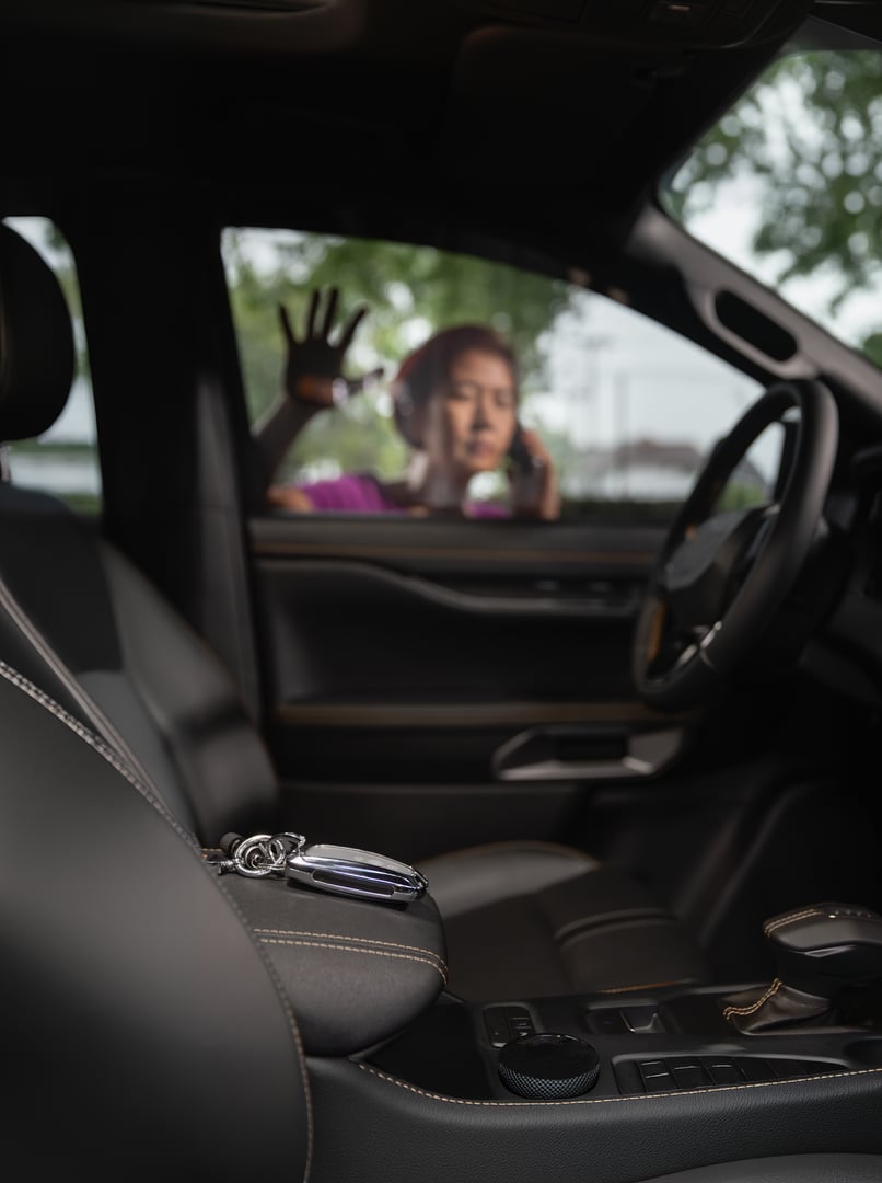 Senior asian woman forgot her key inside locked car.