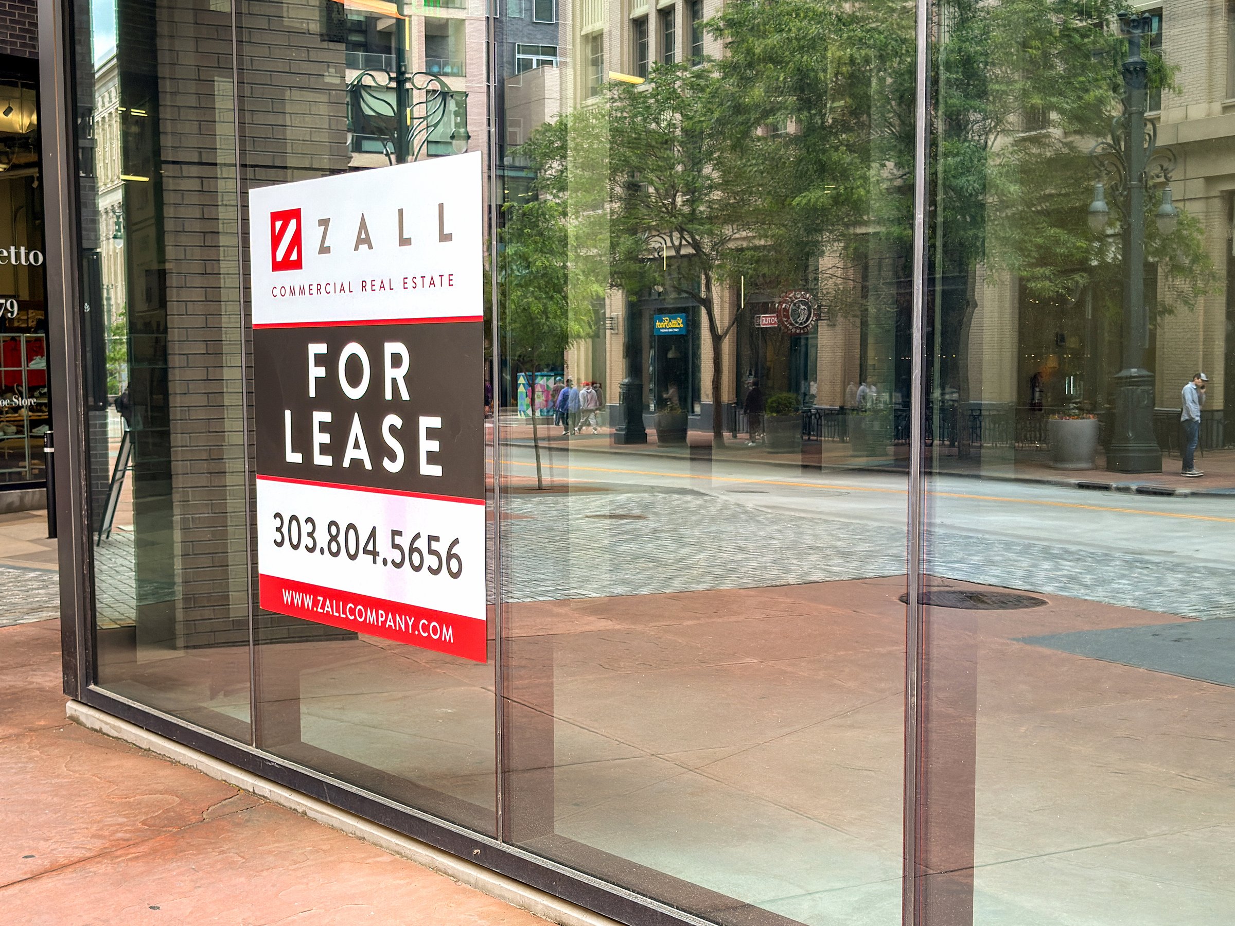 Denver, Colorado, USA - 4 June 2025: Front exterior view of an empty shop for lease in downtown Denver.
