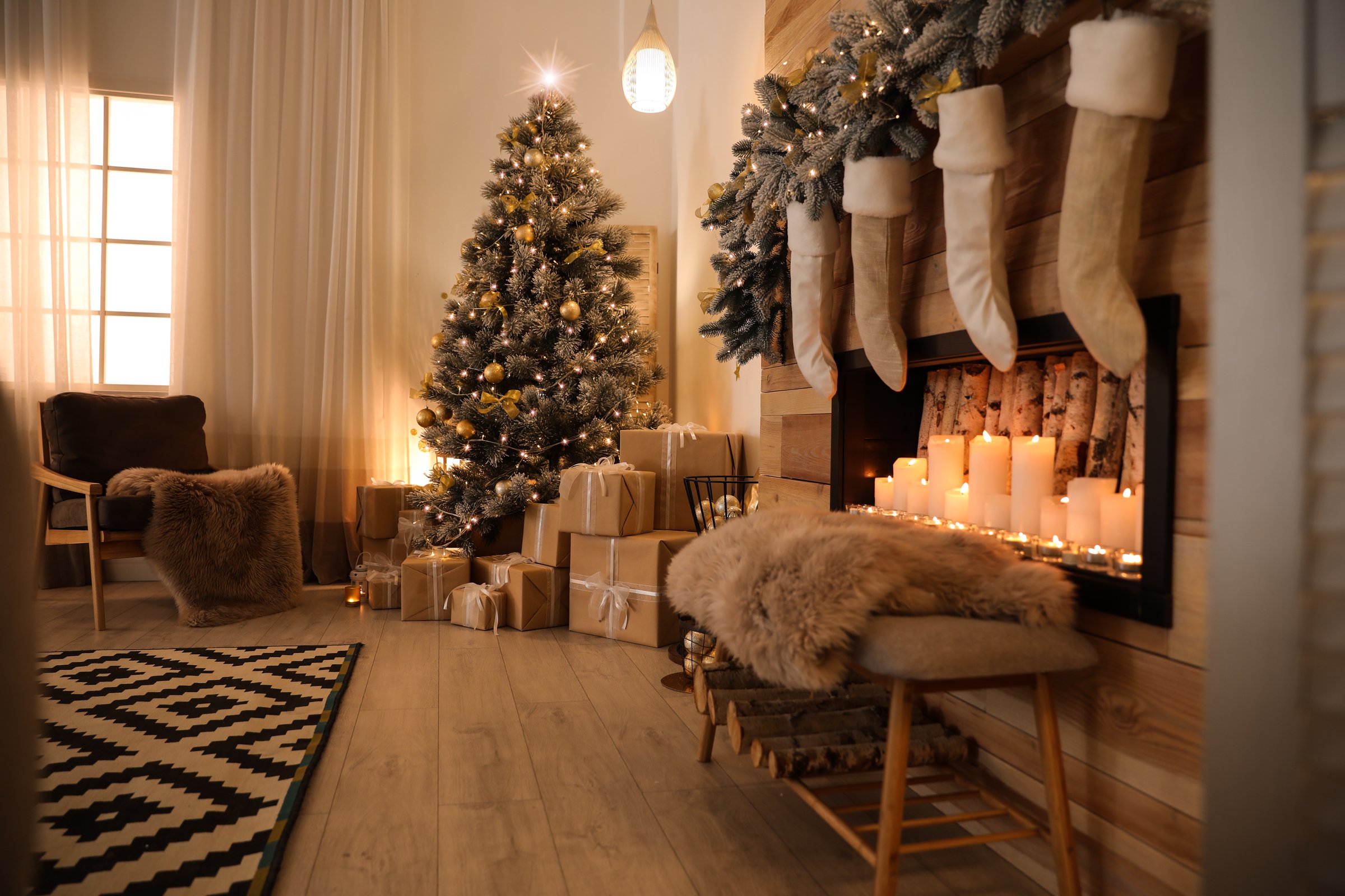 Festive scene with Christmas tree, fireplace, and gifts creating a warm and inviting atmosphere. Ideal for holiday home decor or seasonal promotions.