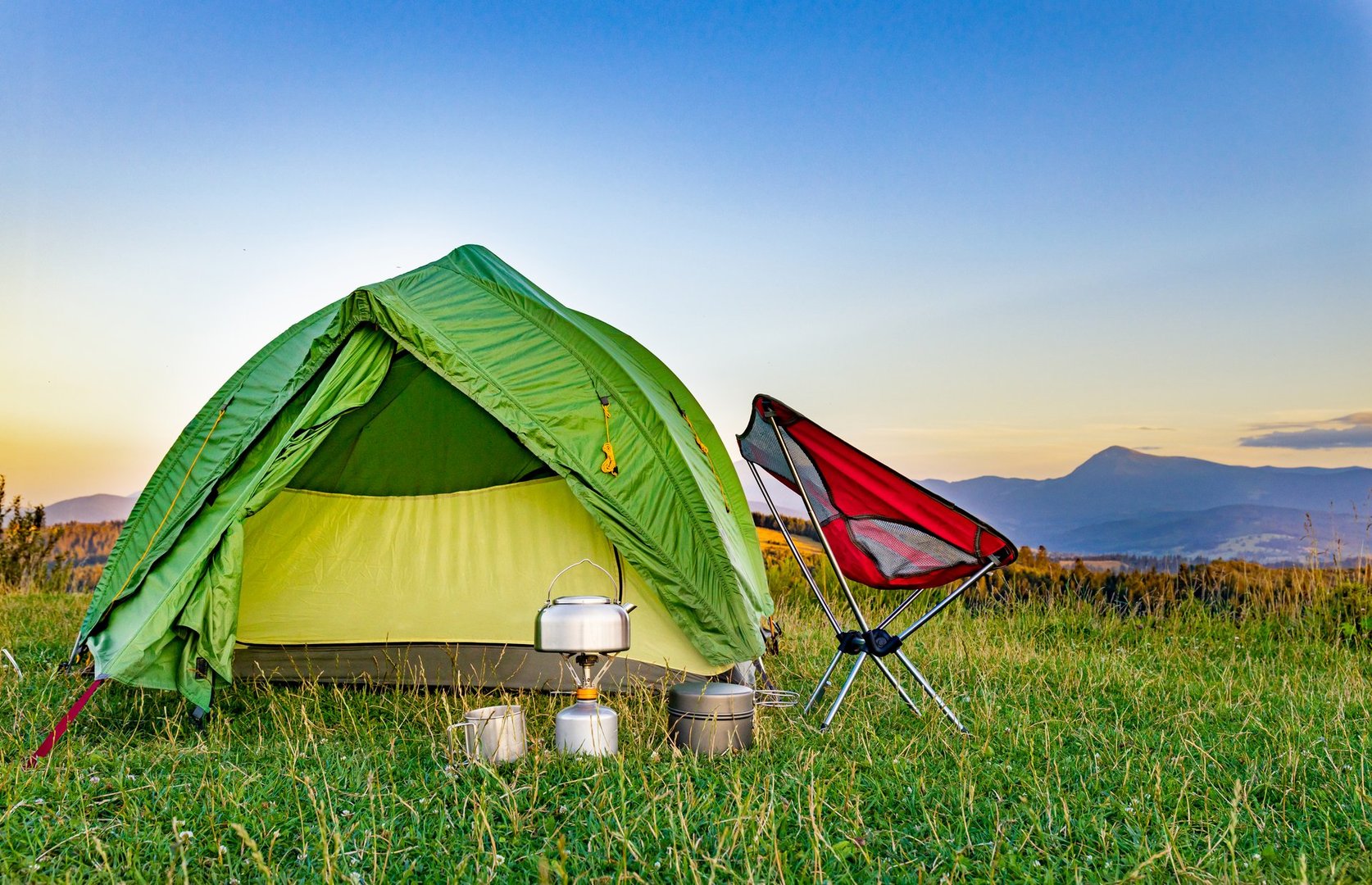 Equipment for camping and hiking in the mountains in summer.