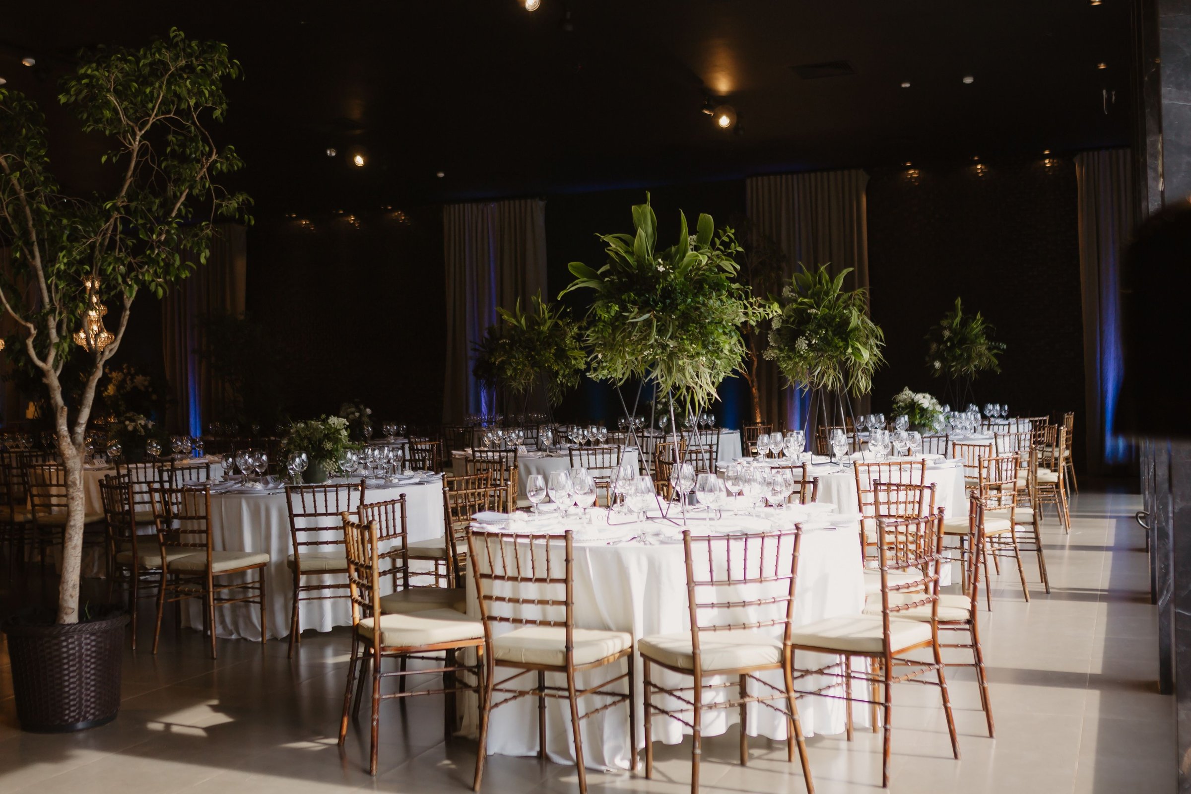 The interior of a restaurant decorated with flowers for a wedding celebration ceremony