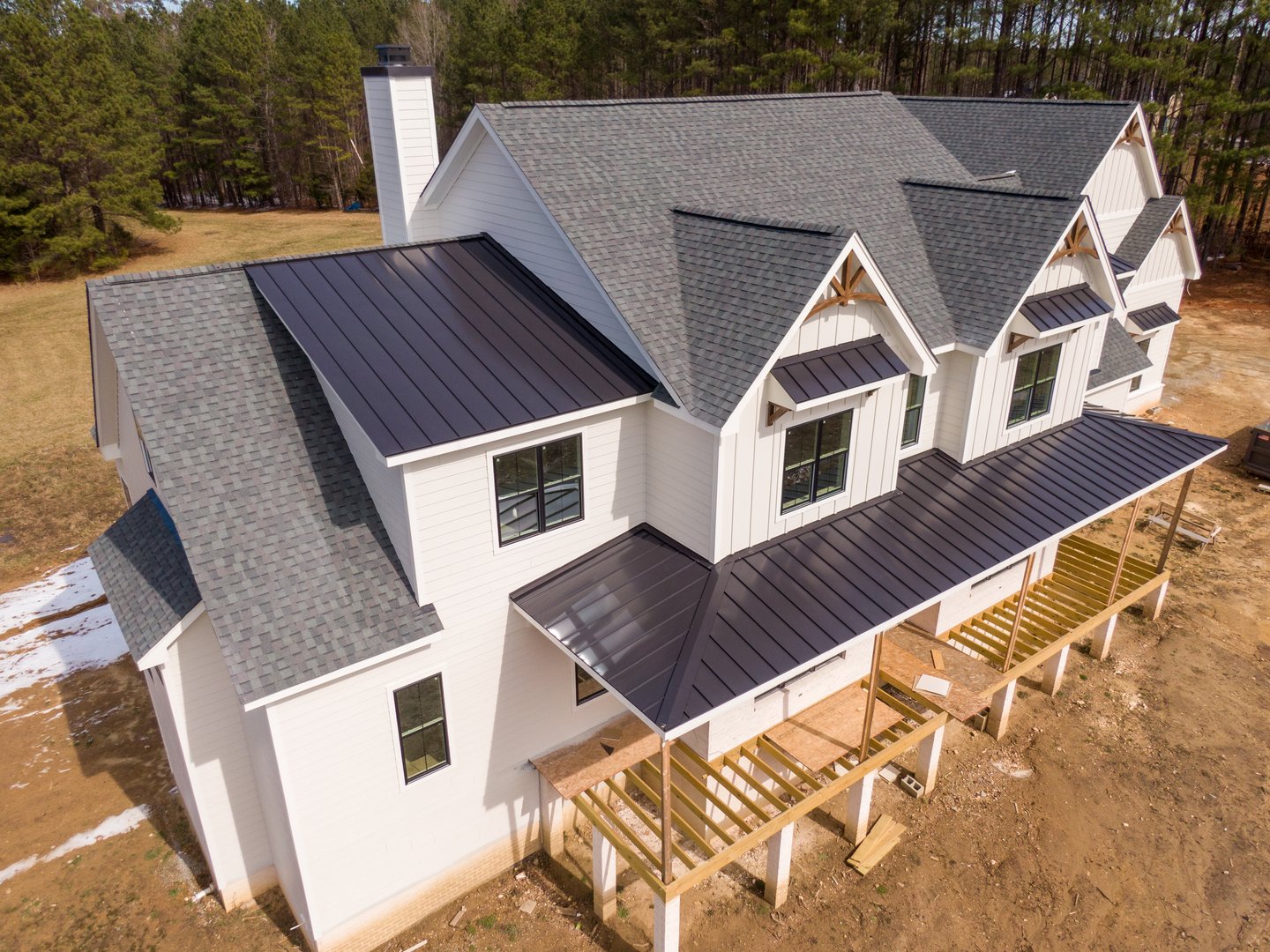 Custom home under construction with modern farmhouse design