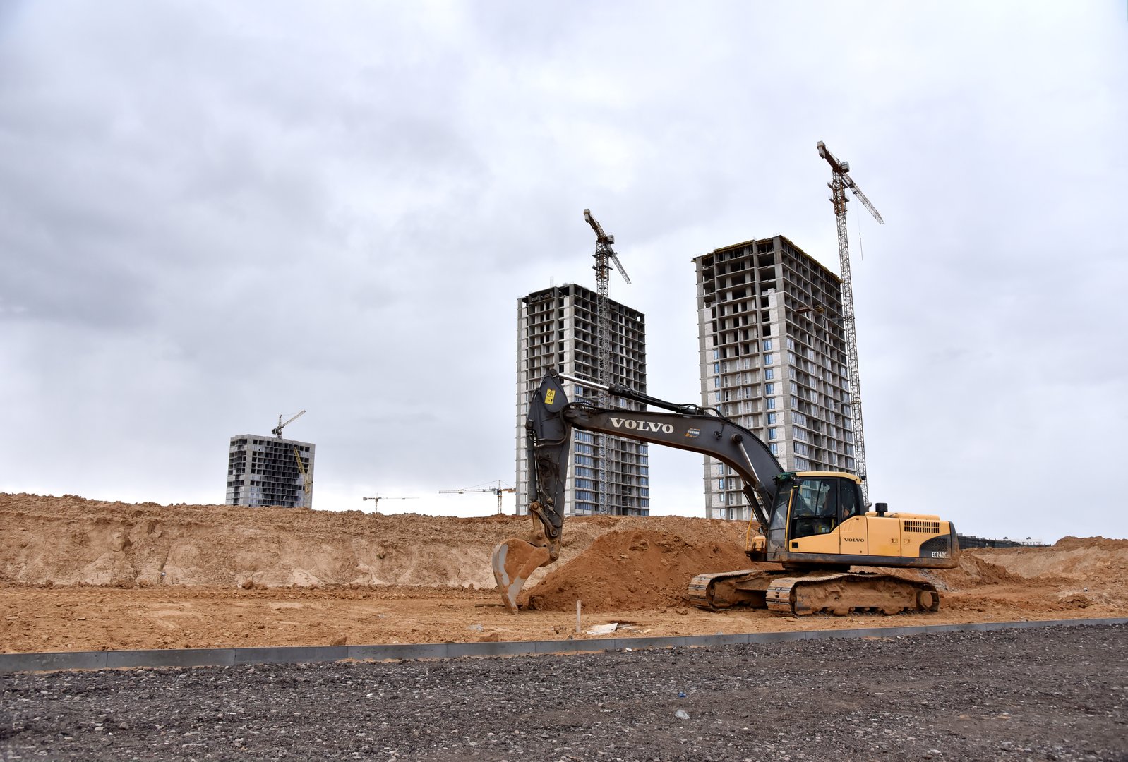 Excavator VOLVO EC240 working at construction site. Earth-moving equipment. Russia, Moscow region, November 11, 2020