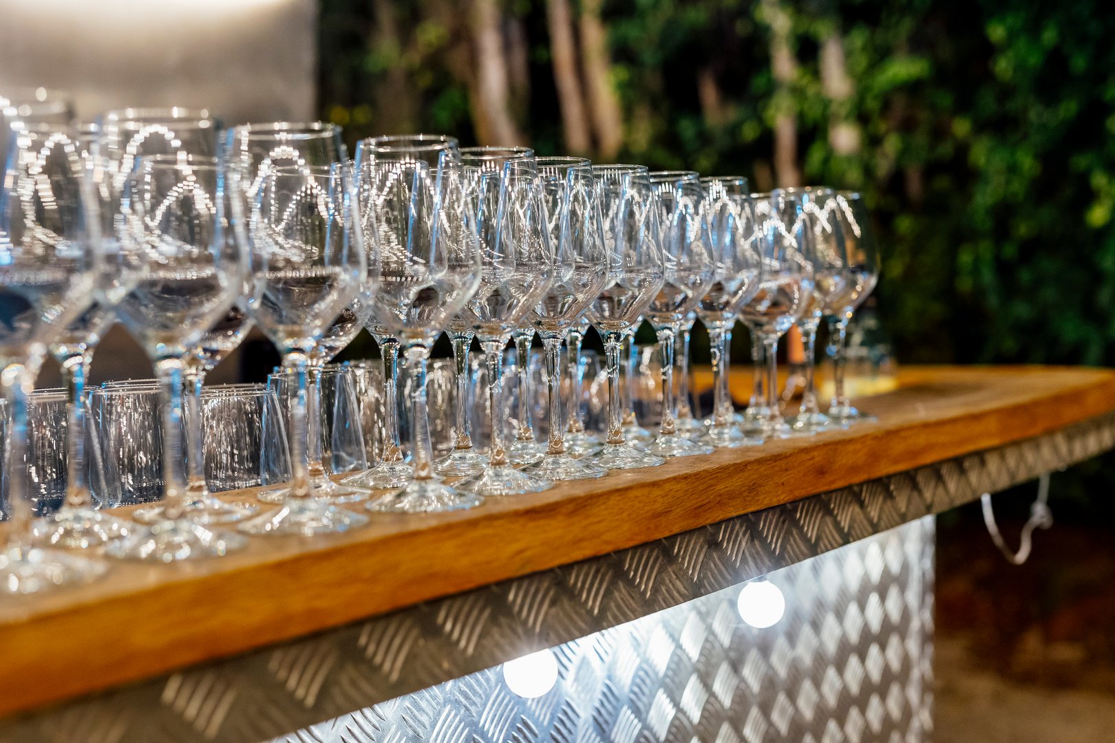 Romantically set dinner table with wine glasses and floral centerpiece, perfect for a wedding