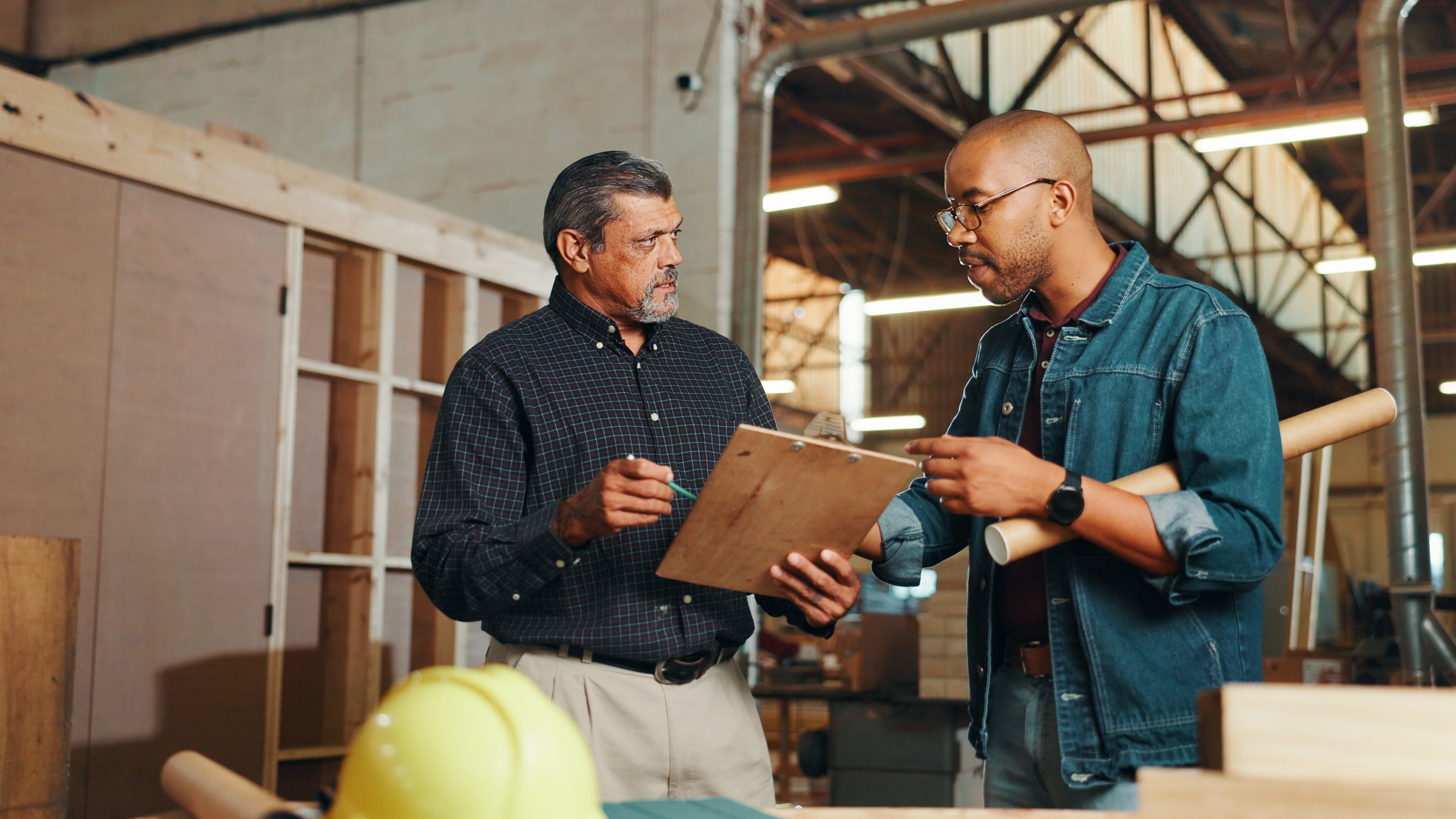 Clipboard, teamwork or people in carpentry workshop for factory, check inventory or furniture production.