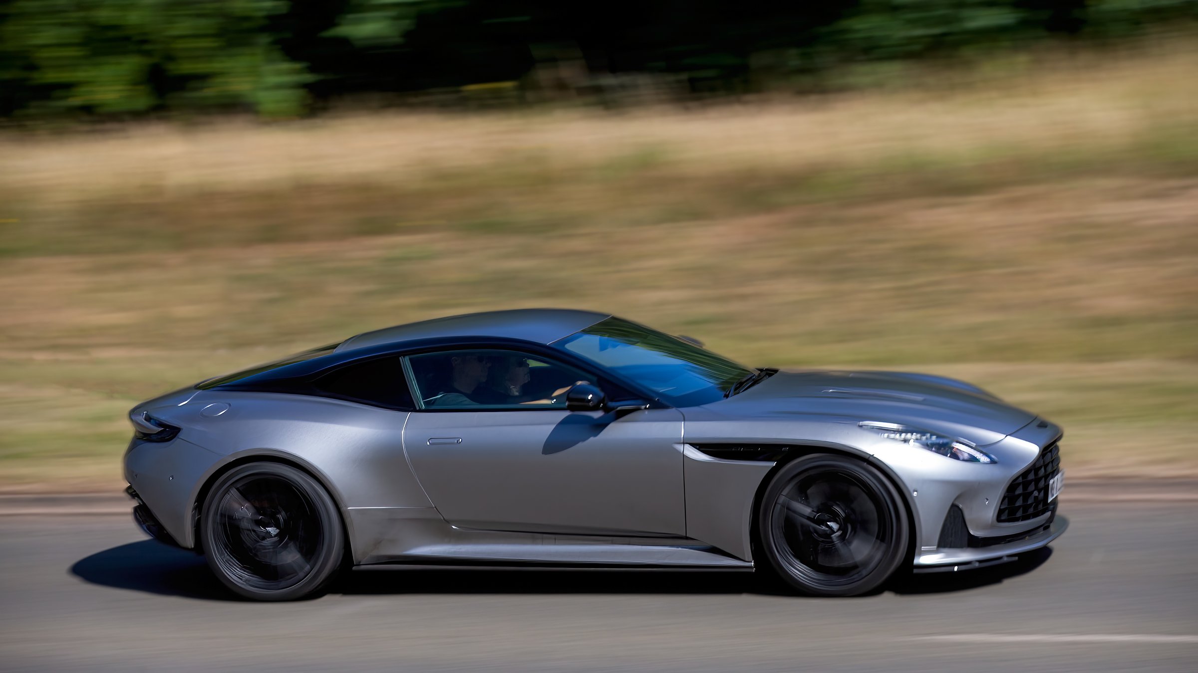 Milton Keynes,Bucks,UK - July 12th 2025: 2023 silver Aston Martin DB12 V8 car driving on a British road