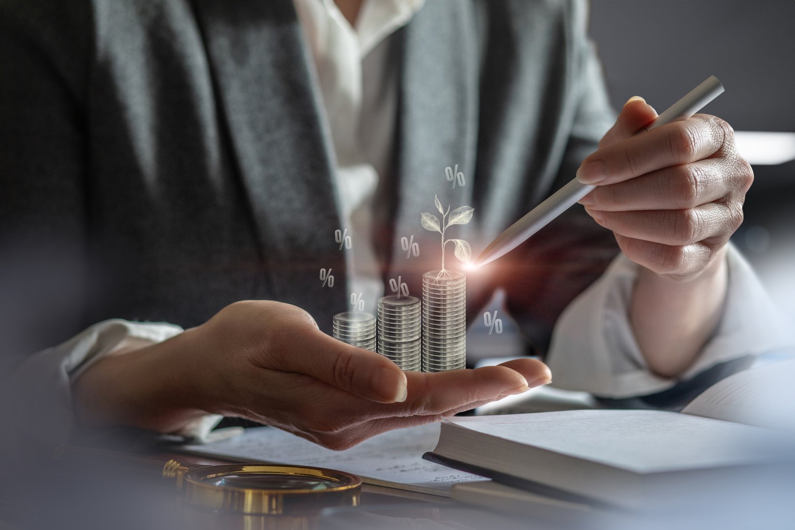 The investor shows the process of accumulating money and growing profits in the palm of his hand.