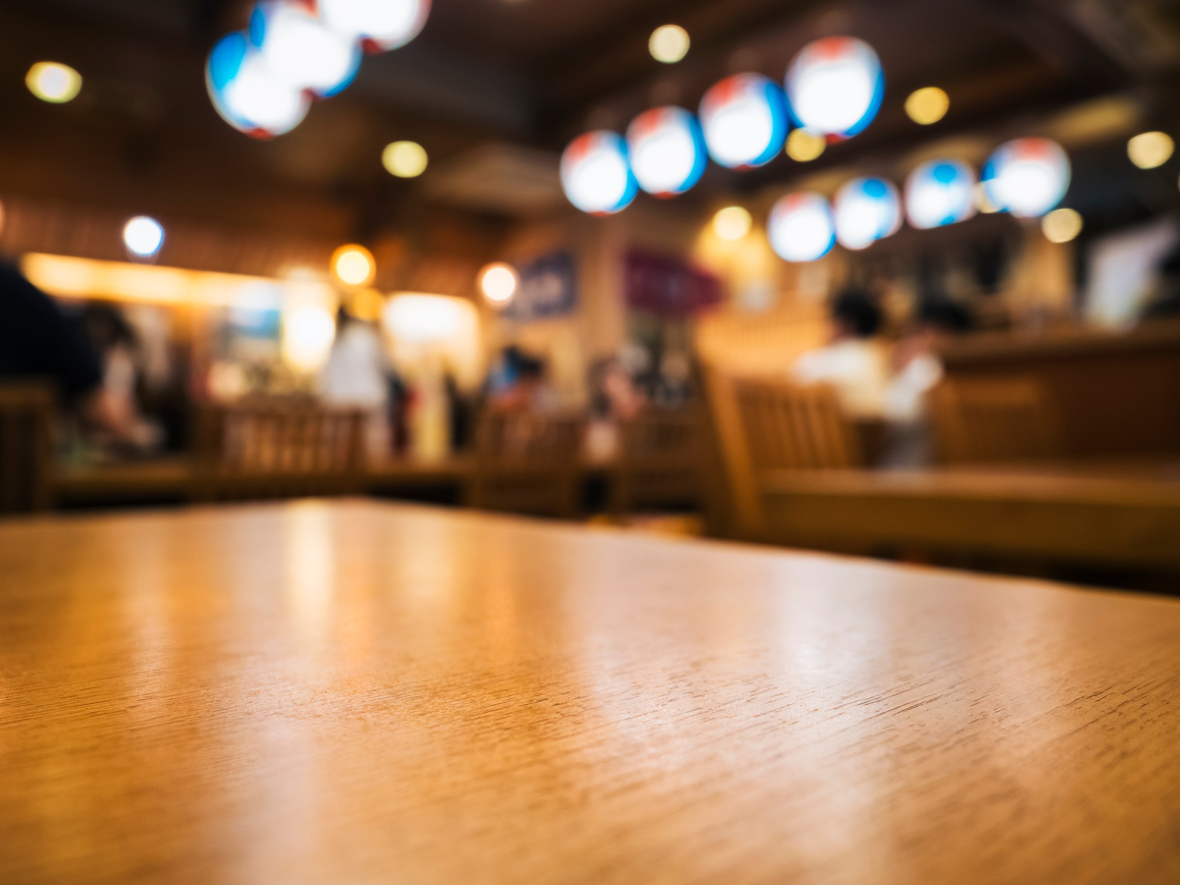 Table top wooden counter Bar Restaurant Interior lighting Blur background