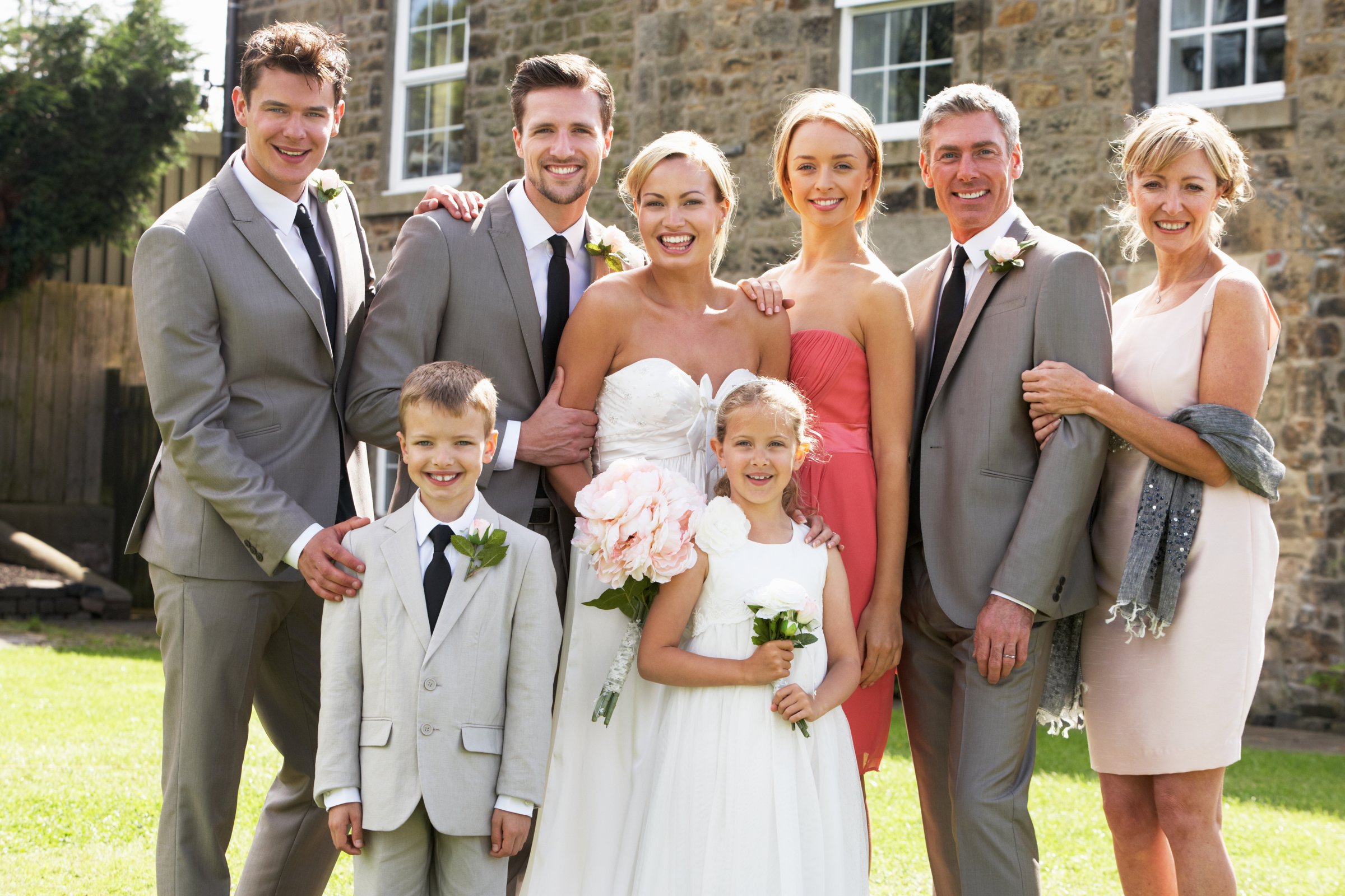 Family Group At Wedding Outdoors Smiling To Camera