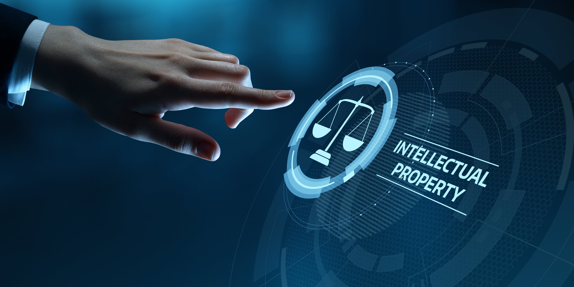 Legal Protection and Intellectual Property Concept:: Businessman touch digital icon.