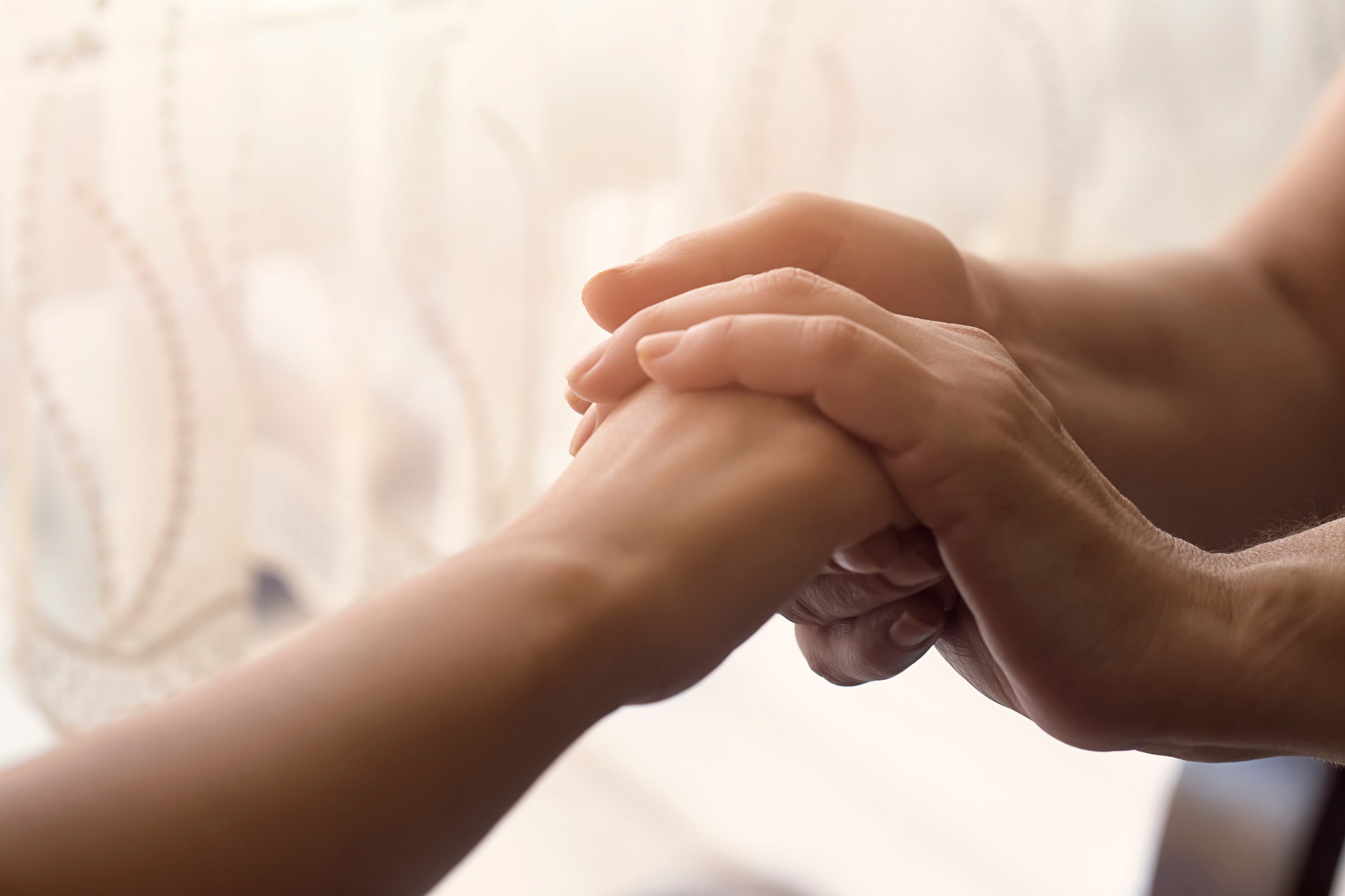Hands of old and young