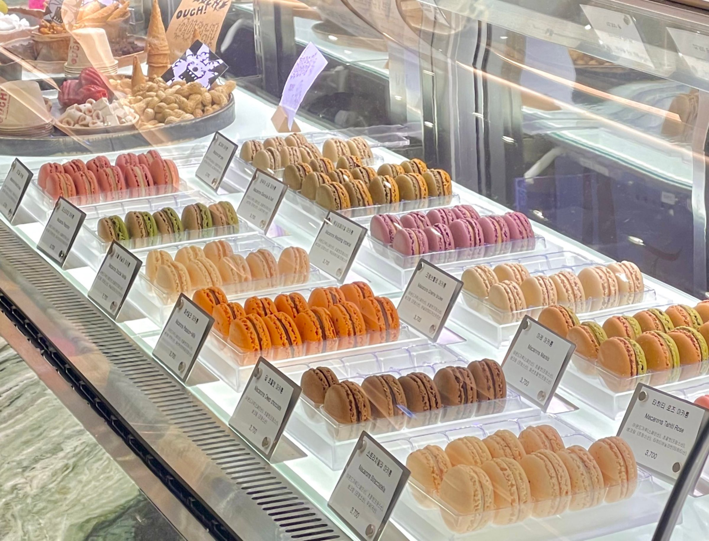Beautiful and delicious pastries displayed in a bakery, with colorful glazes, delicate toppings, and tempting texturesoffering a perfect visual feast of sweetness and artisanal charm.