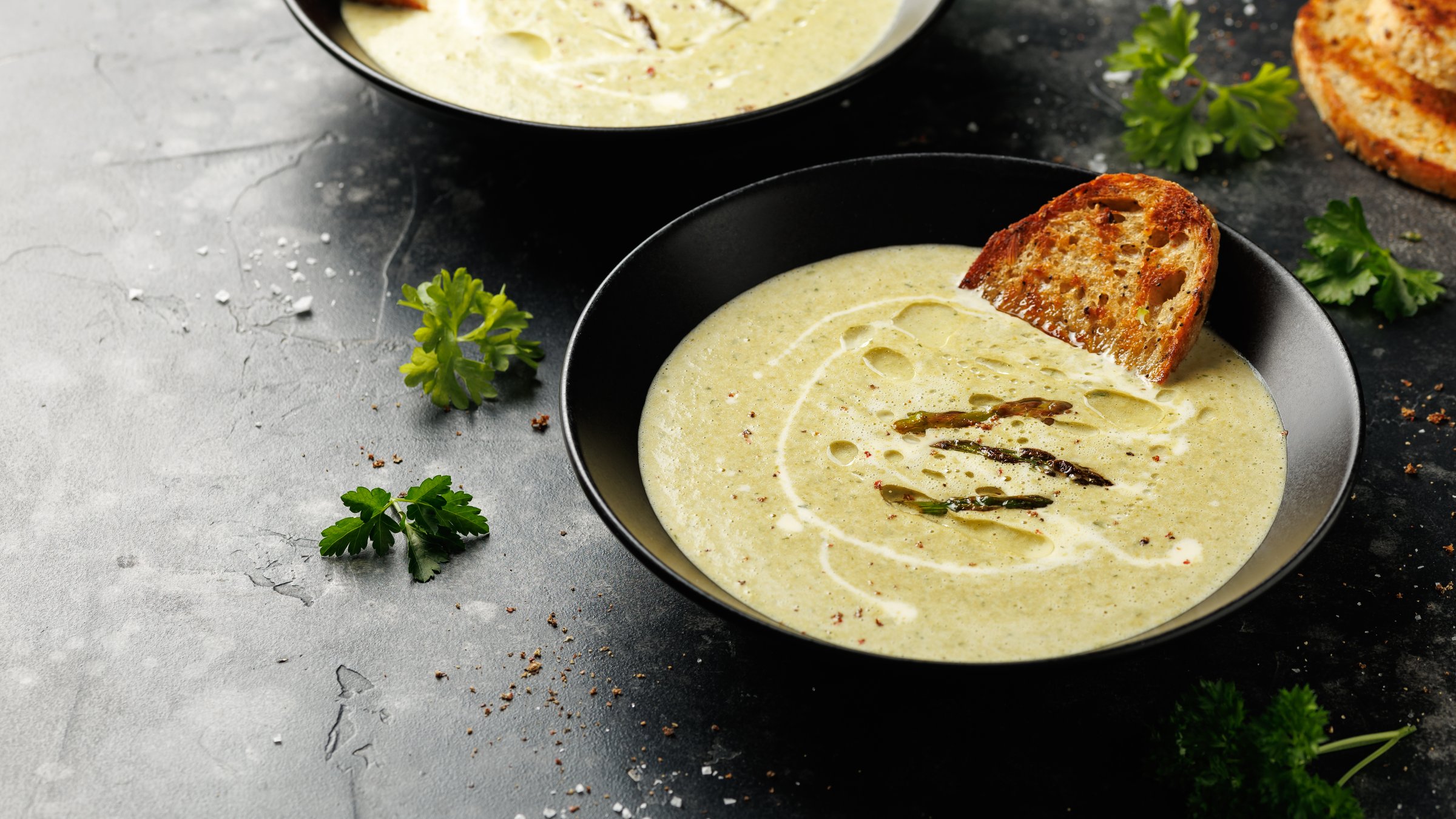 Asparagus and mint cream soup with sour dough toast bread.