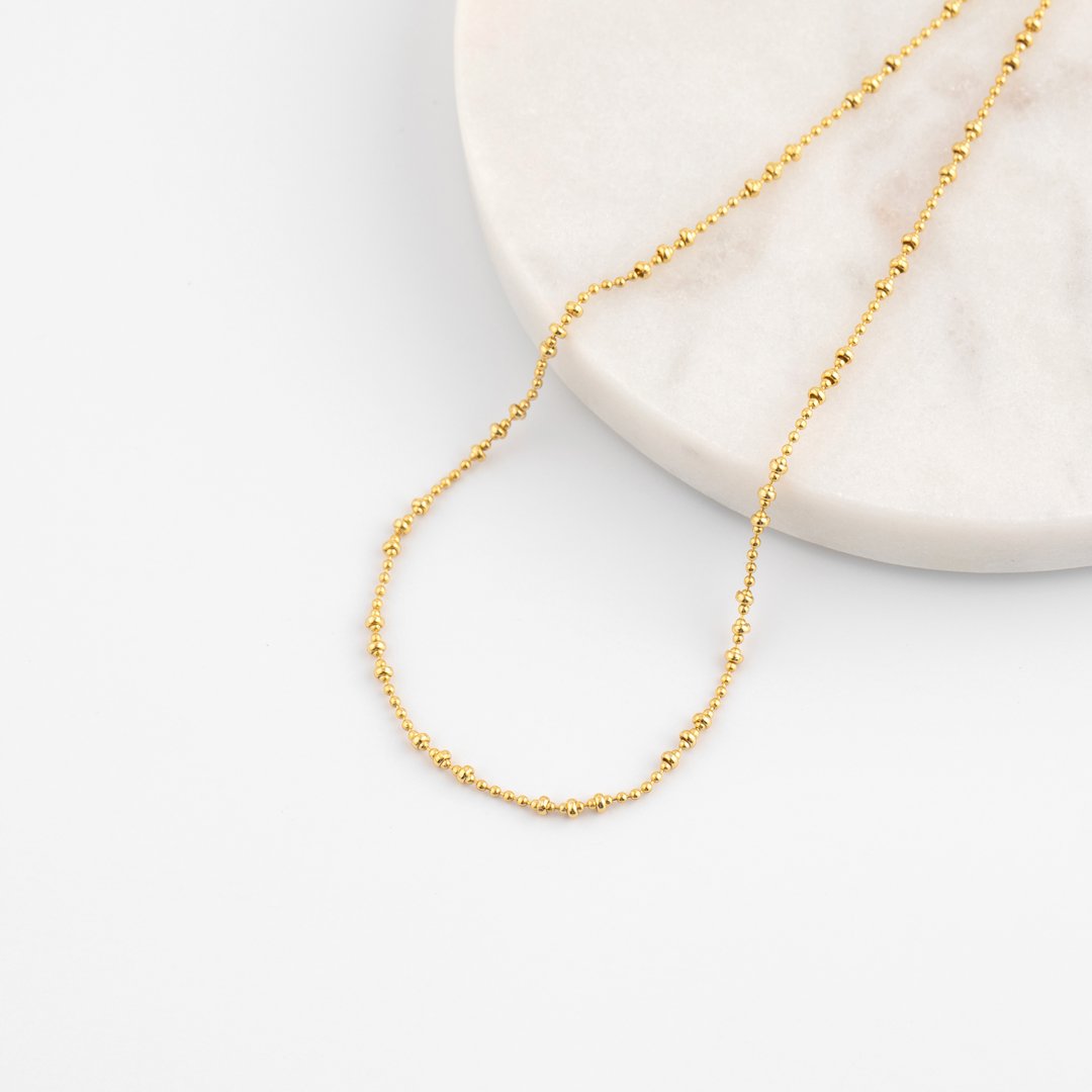 Gold chain on a white background. Jewelry catalog. Stylish chain.