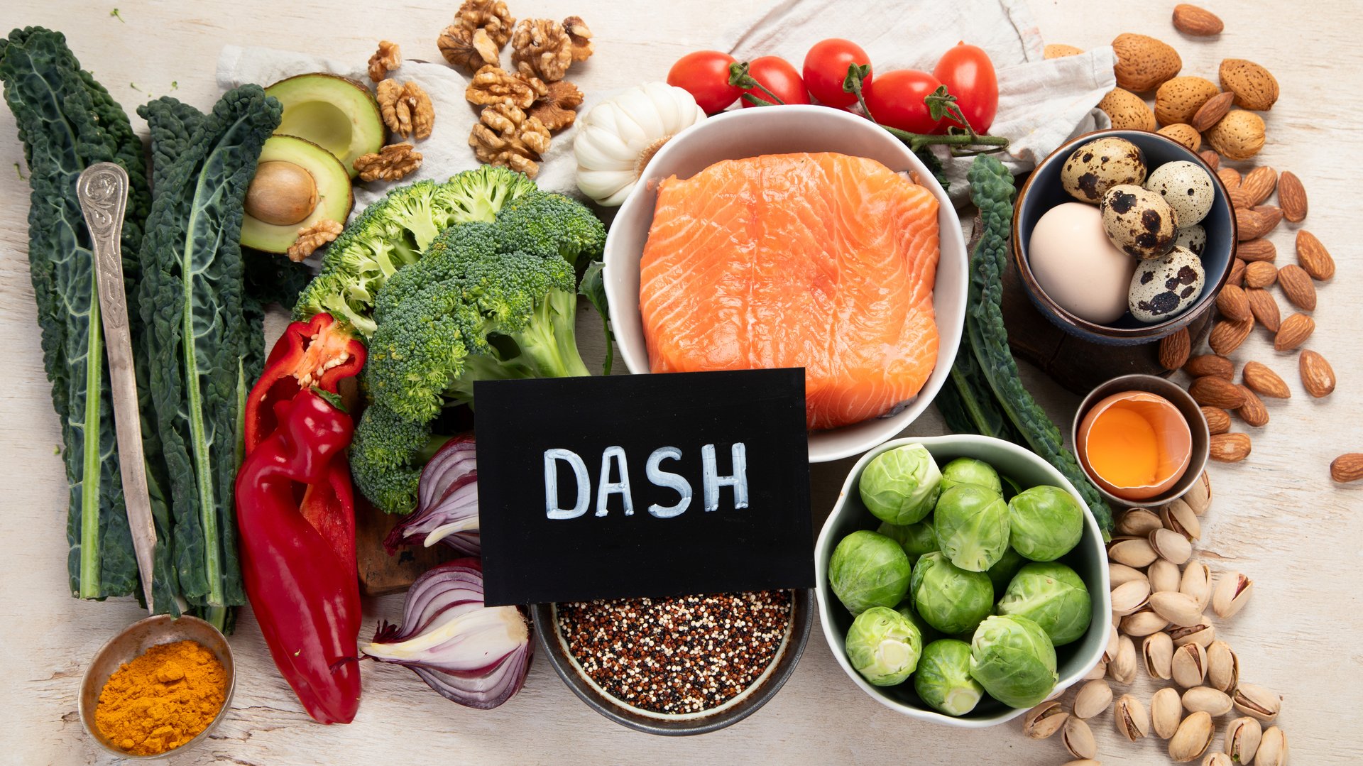 Various brain food products: fish, meat, nuts, vegetables and greens. Healthy food on a light background. Top view.