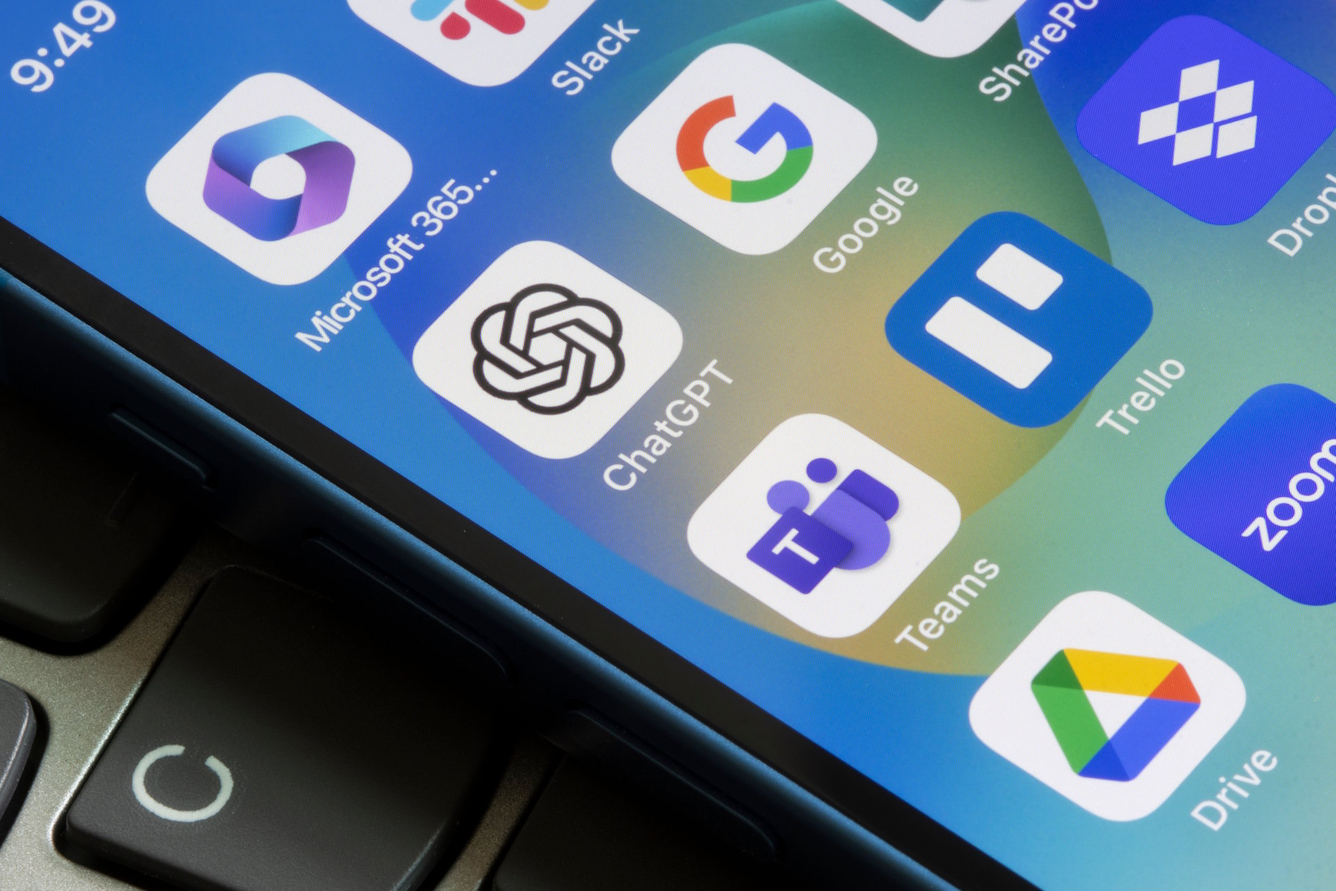 Portland, OR, USA - May 19, 2023: Assorted productivity apps are seen on an iPhone, including ChatGPT, Microsoft 365, Slack, Google, Teams, Trello, Dropbox, Google Drive, and Zoom.