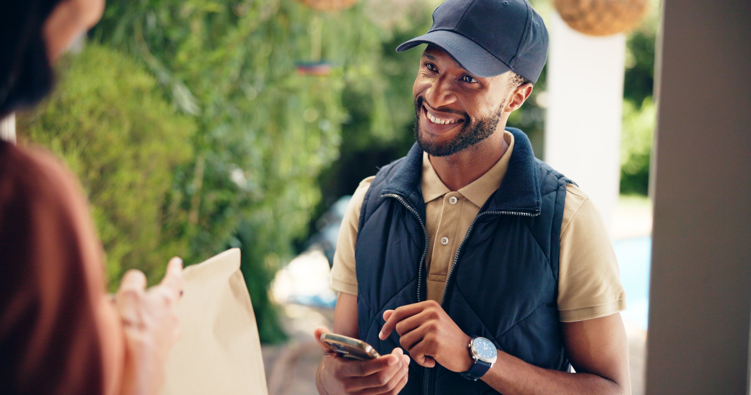 Happy man, delivery or door with package for online order, shipment or shopping at home. Male person, courier guy or distributor with smile for parcel, ecommerce or distribution at customer house