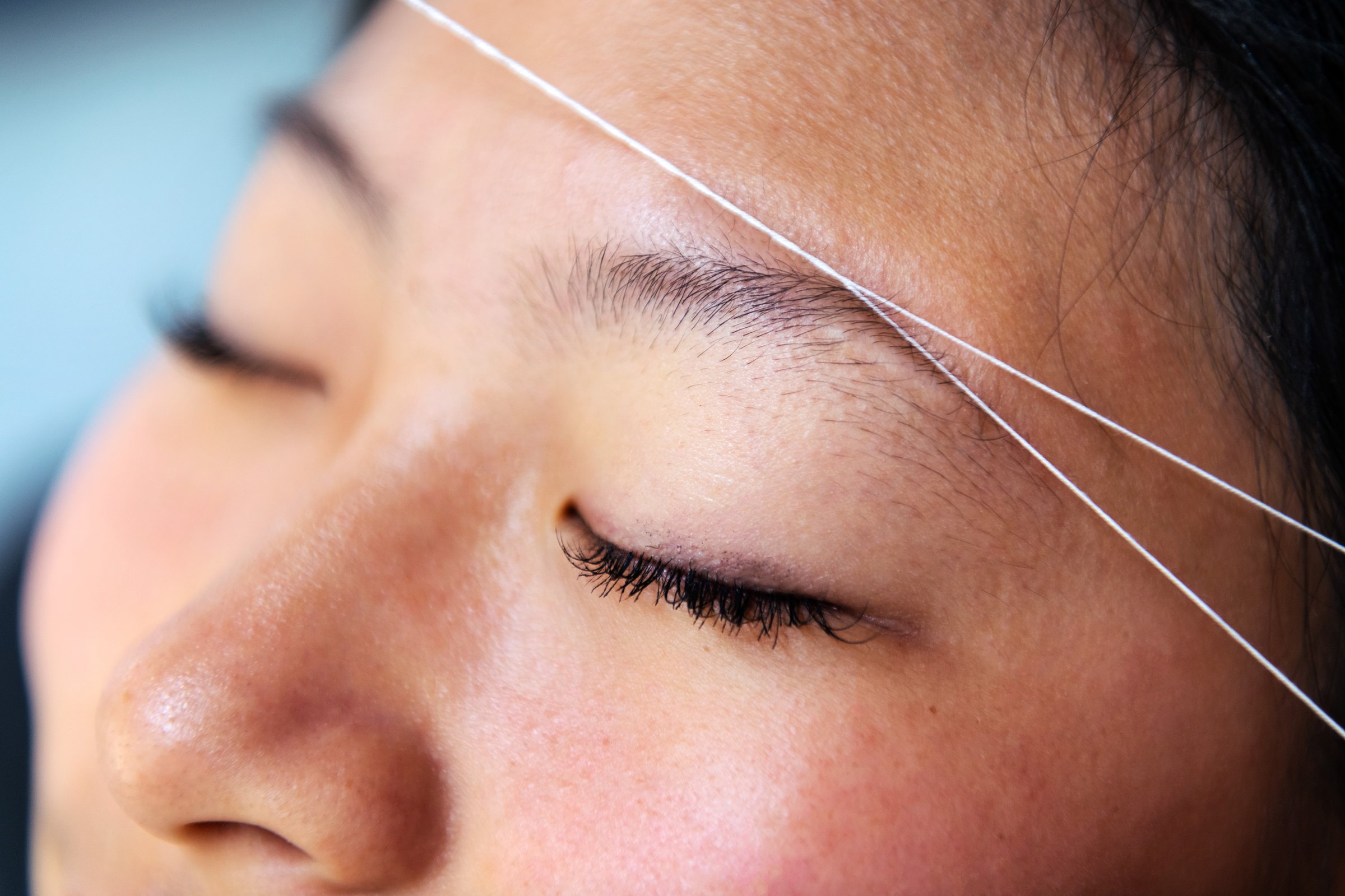 Eyebrow waxing with threading