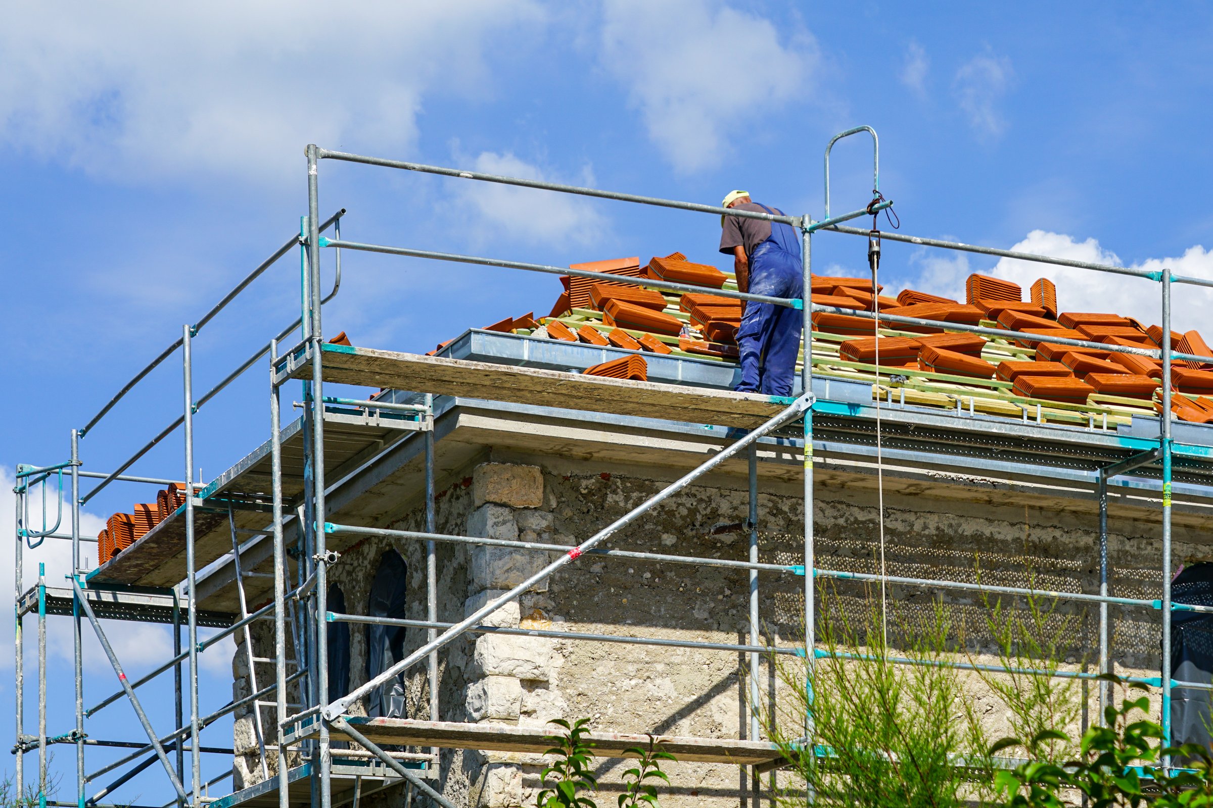 Replacing the clay tile roof covering of an old stone house
