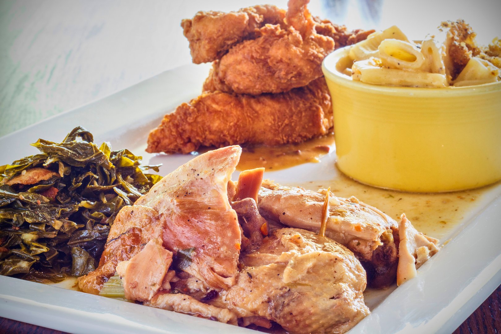 platter of fried chicken, mac n cheese, smoked turkey, and collards