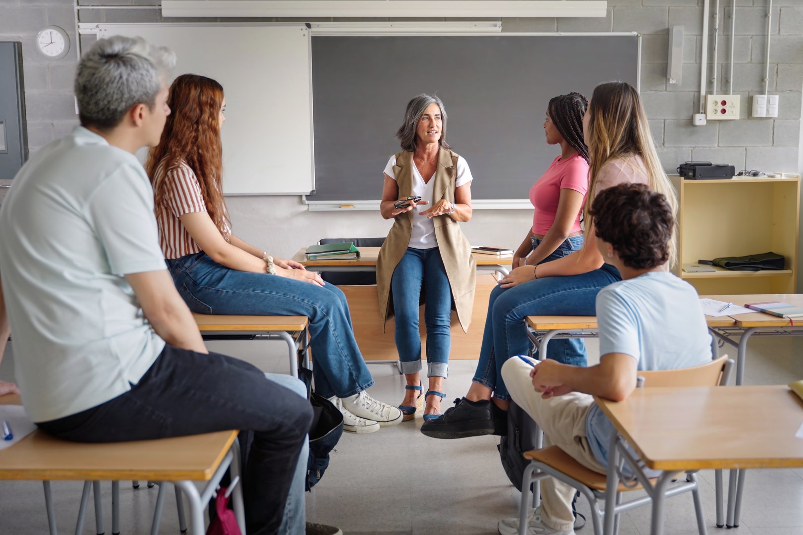 Teenager student class and senior teacher sharing group discussion at High School - Education Mental Health Support