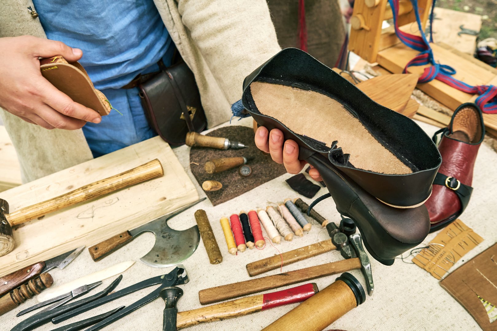 Making medieval vintage leather shoes, items for creating retro boots. Reconstruction of the events of the Middle Ages in Europe.