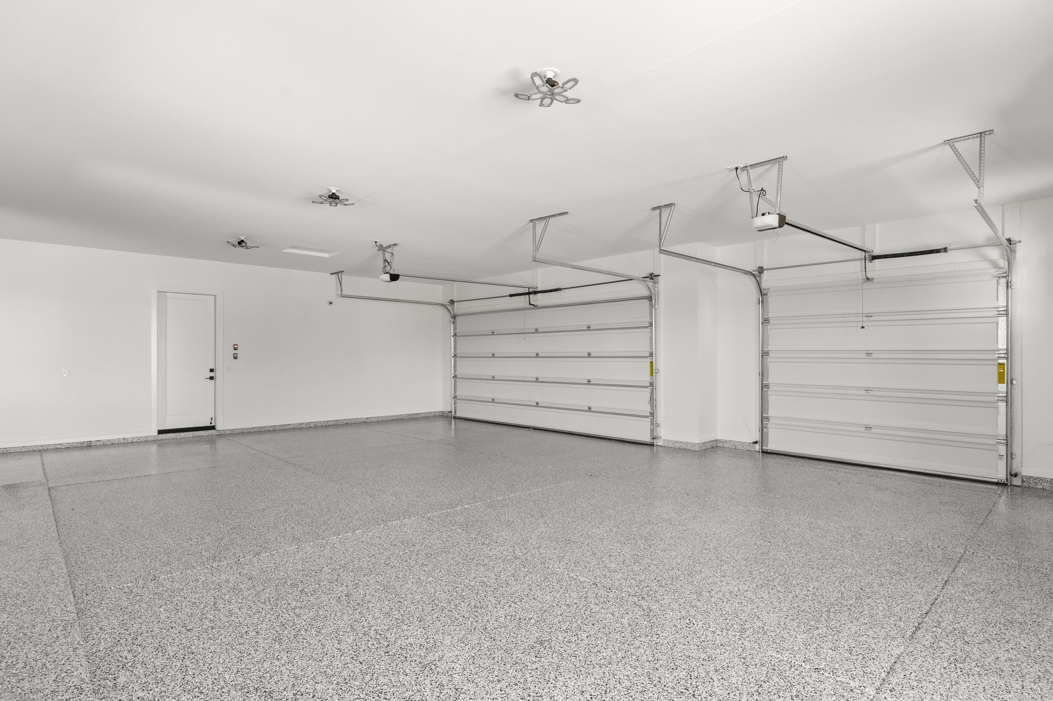 Full flake broadcast epoxy garage flooring installation with durable finish