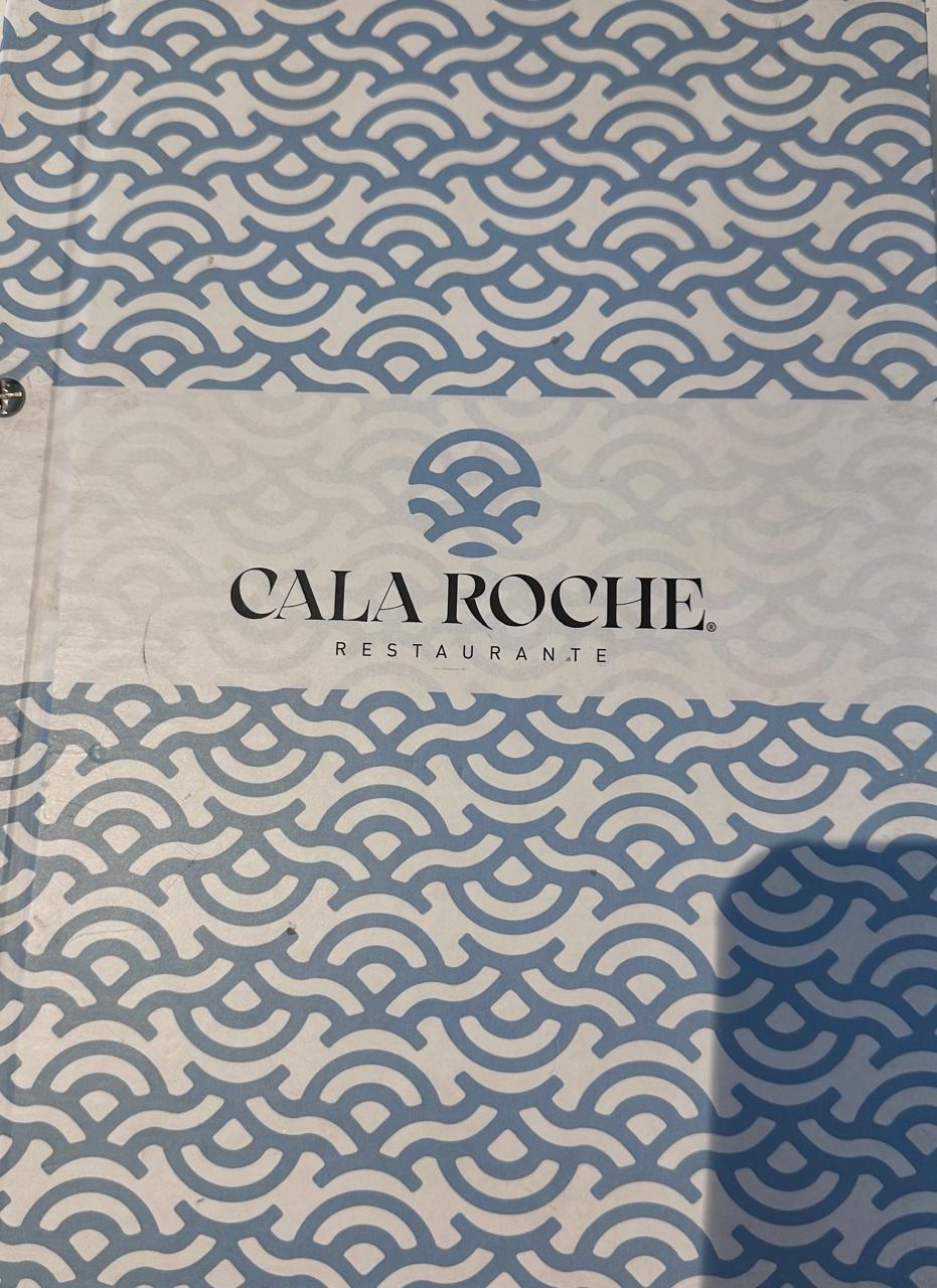 Cover of Cala Roche Restaurant menu with blue wave pattern on a white background.