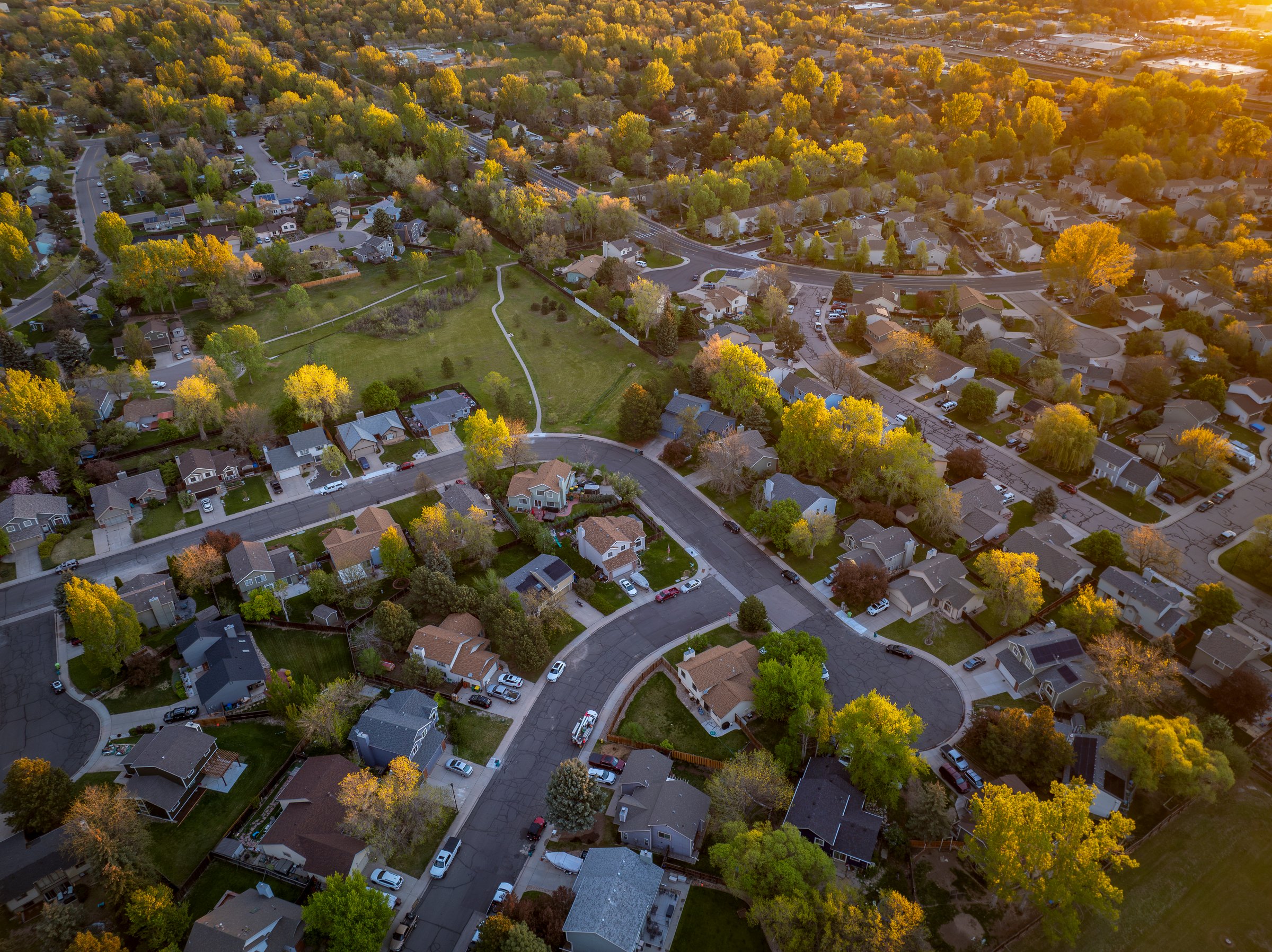 springtime sunrise over residential area of Fort Collins in Colorado, aerial view