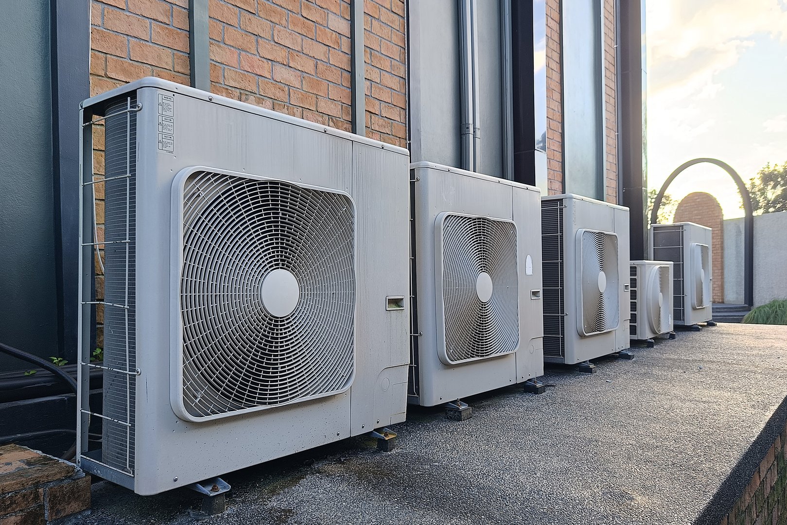 Row of air conditioning units outside a building