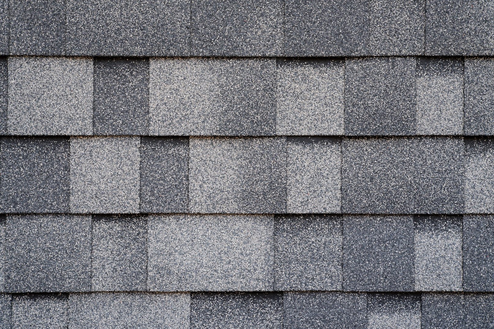 Gray asphalt roofing tiles, overlapped