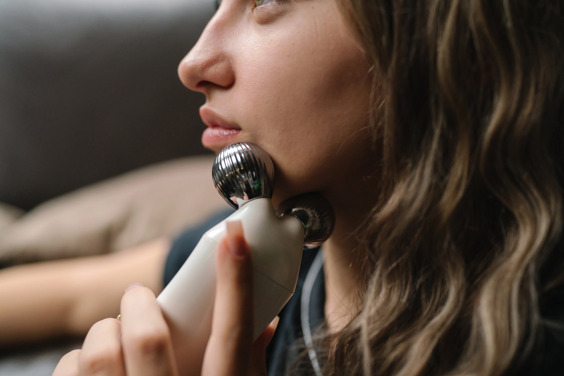 Jawline massager applying gentle pressure