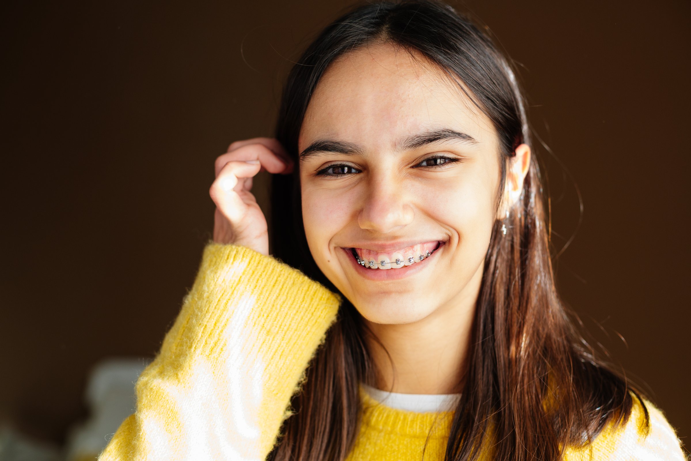 Portrait of a happy teen girl with braces smiling