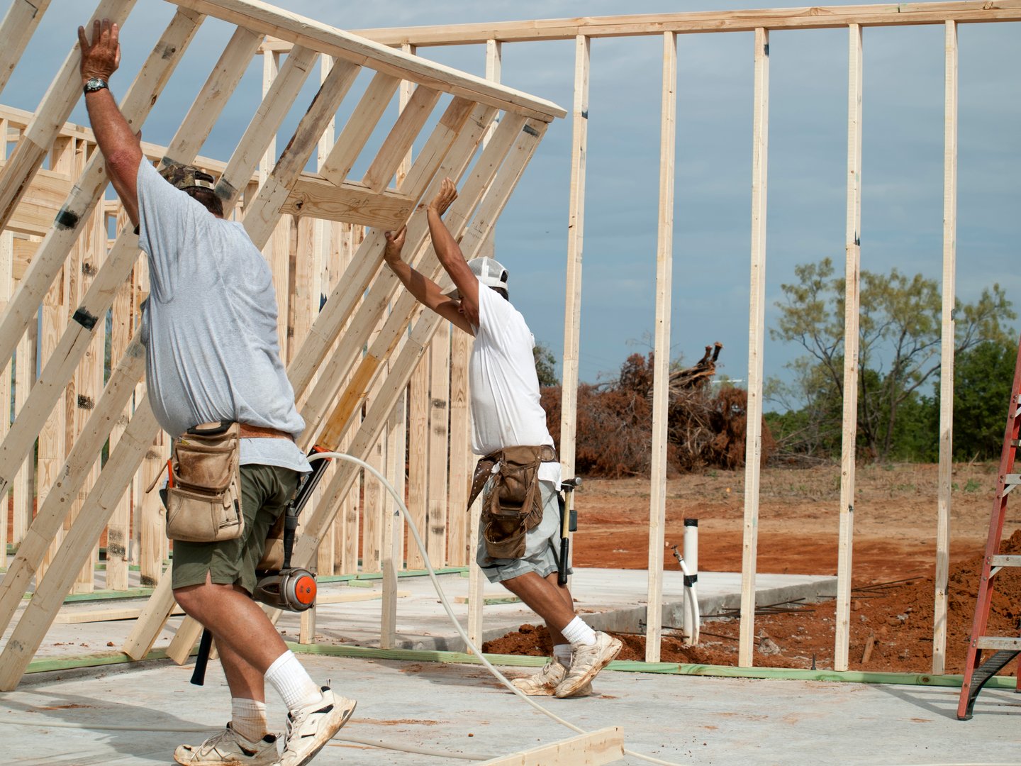 House Construction Site with Workers