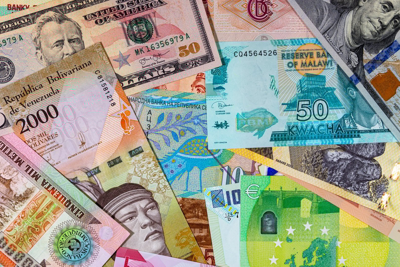 Paper and polymer money of different countries. Money background.