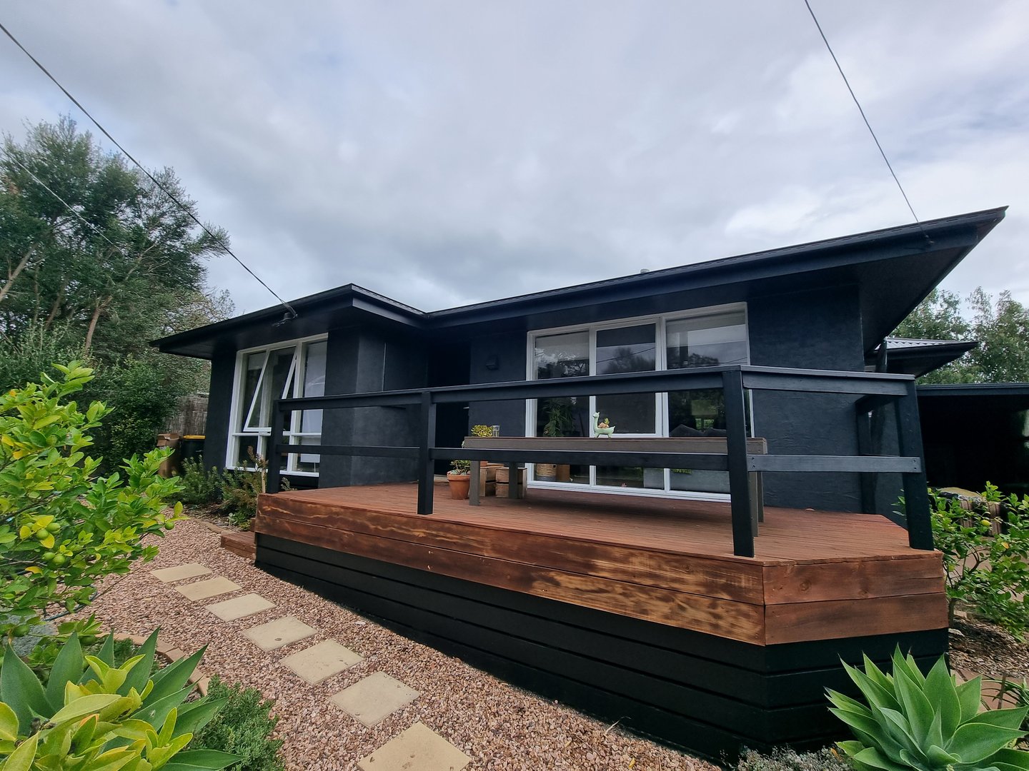 Contemporary family home exterior after painting transformation by Quality Painting Group