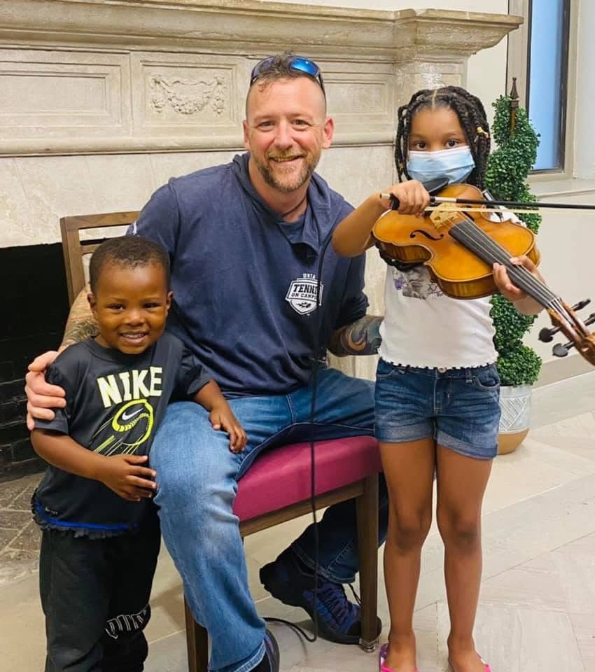 Carl Schmid teaching violin lesson