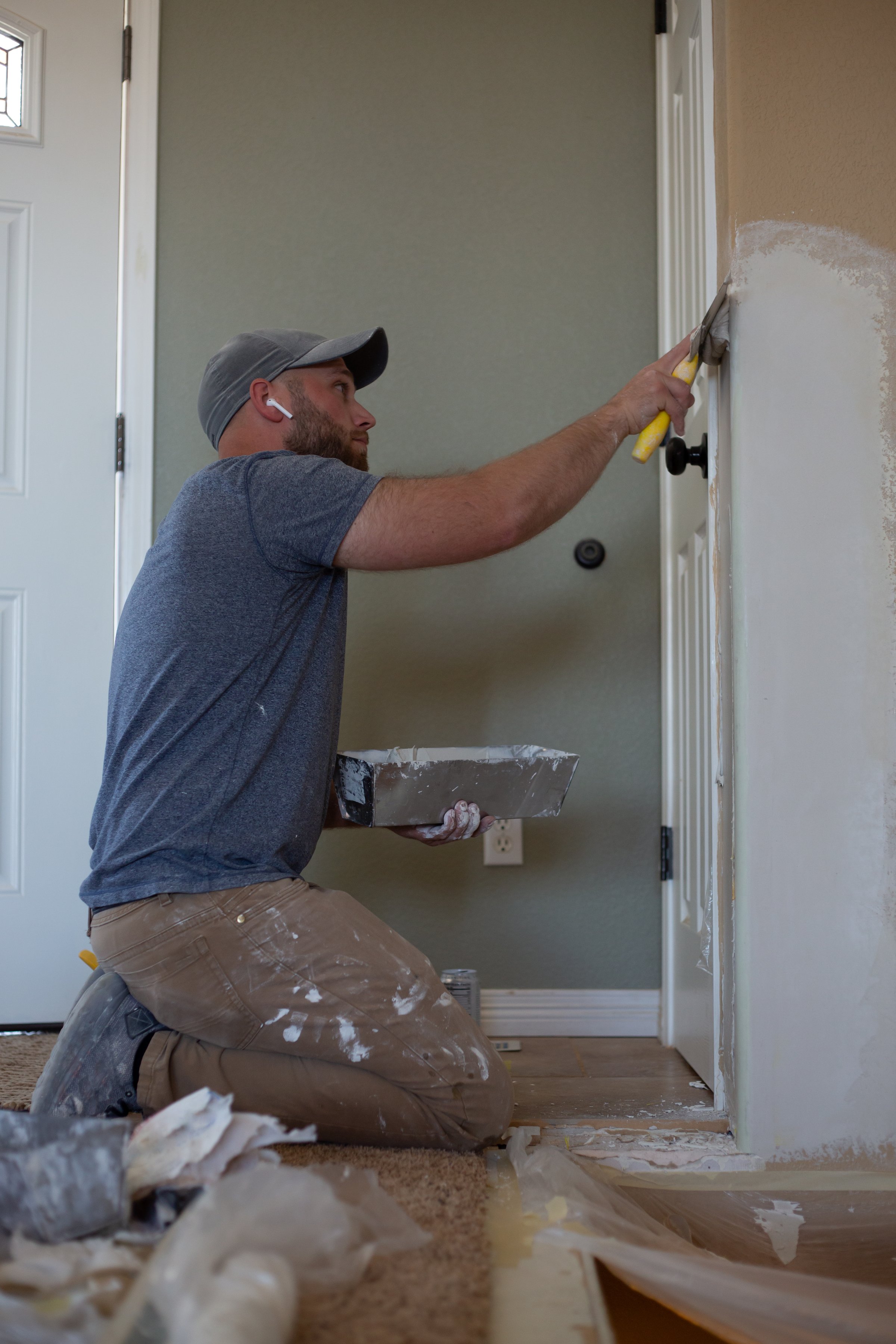 Drywall repair on a home renovation project.