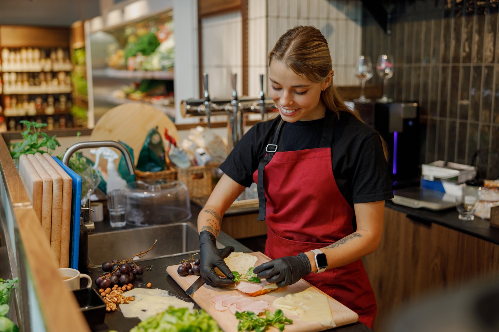 A young, talented chef expertly chopping a variety of fresh vegetables in a vibrant, modern kitchen setting