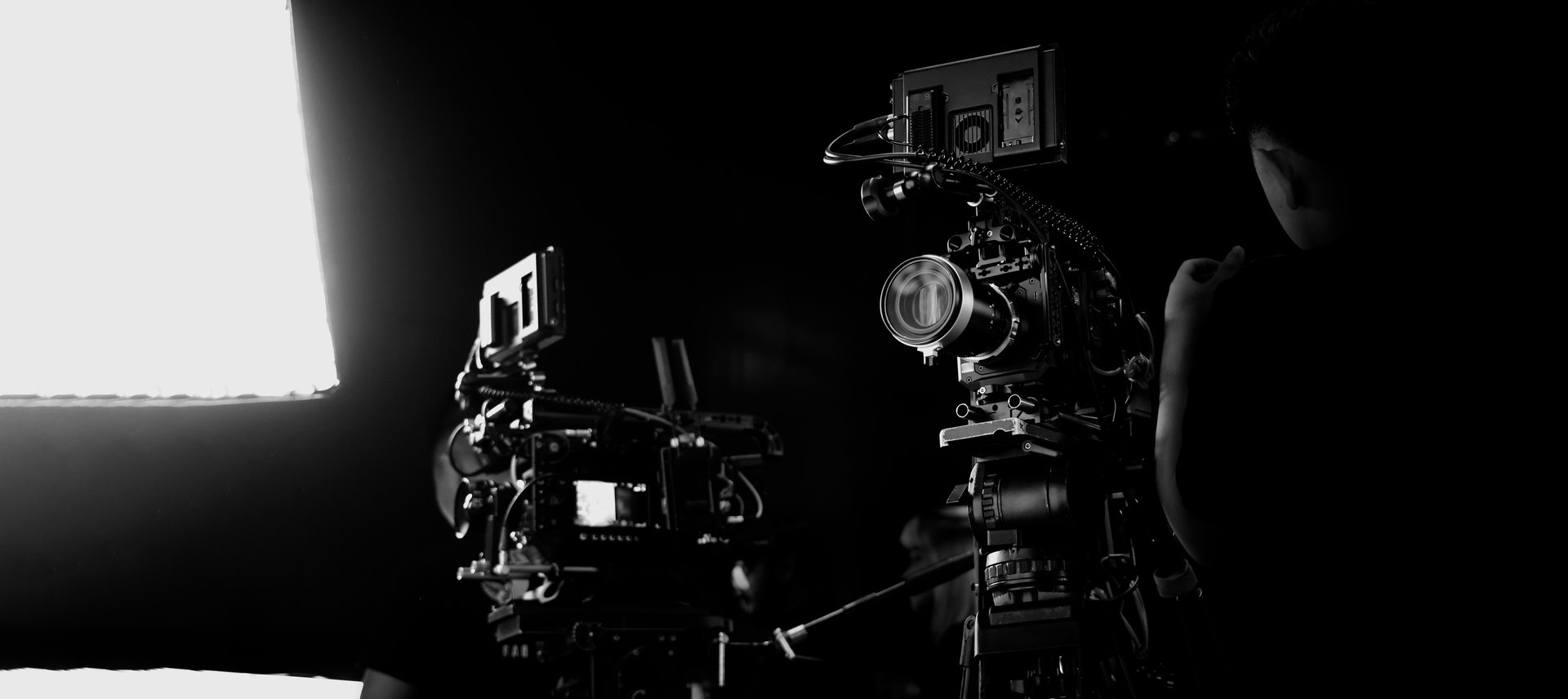 Film production setup with cinema cameras and crew